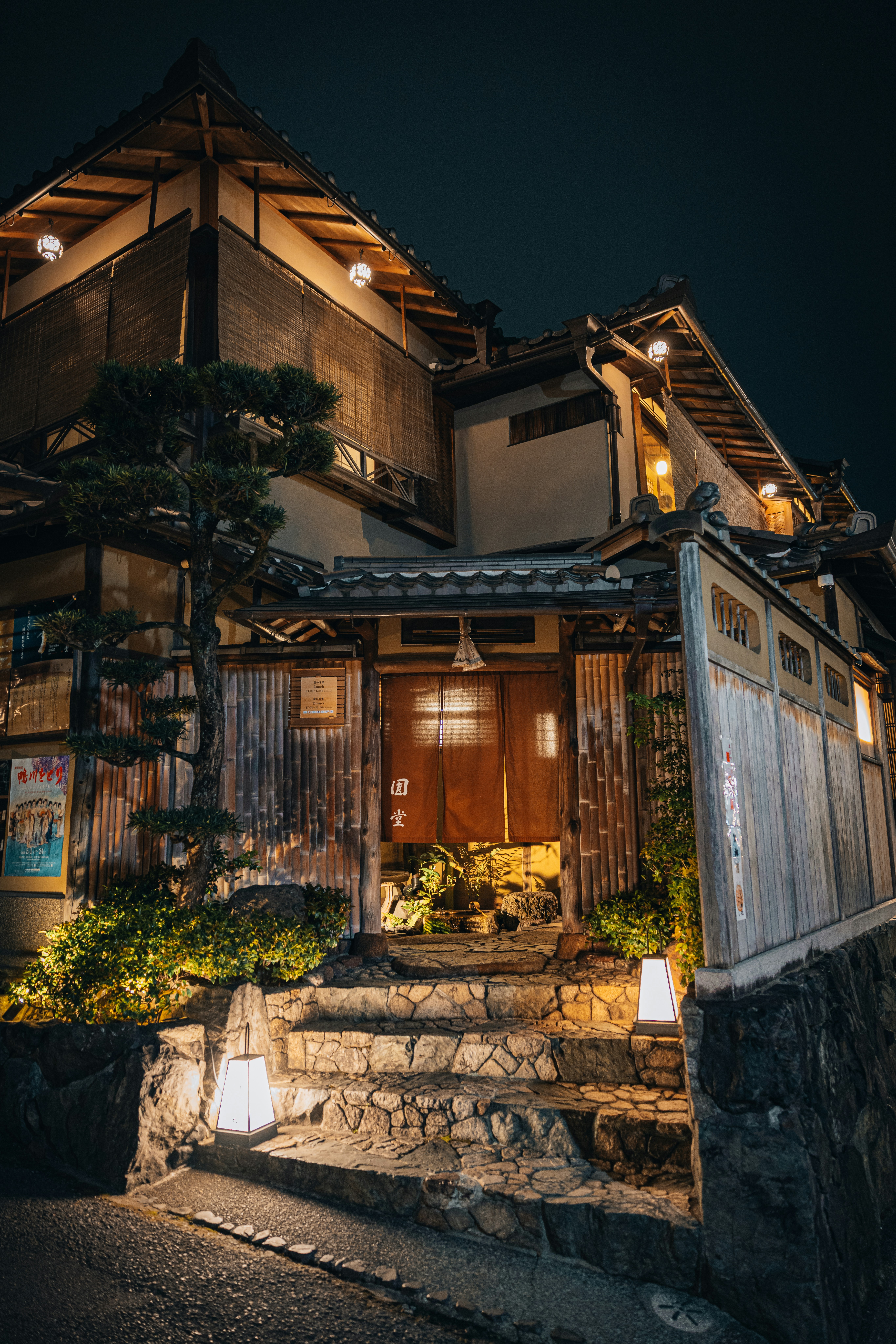 Traditional japanese building illuminated at night.