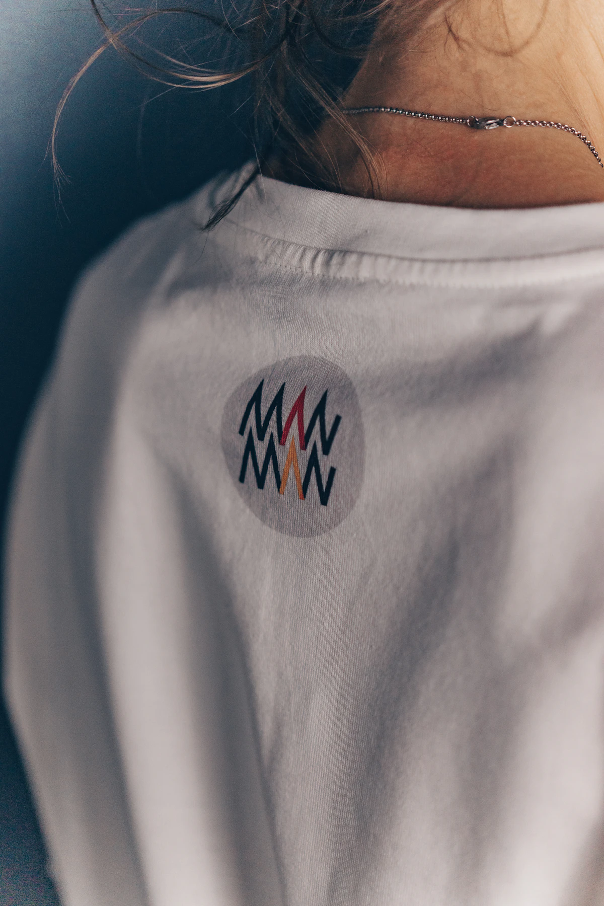 Back of a polo shirt showing an embroidered company logo