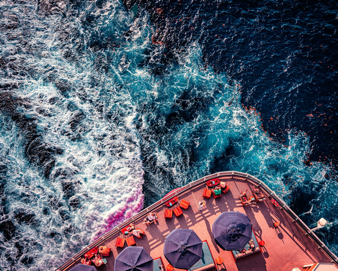 A ship travels through the ocean waters., Virgin Voyages cruise ship wake