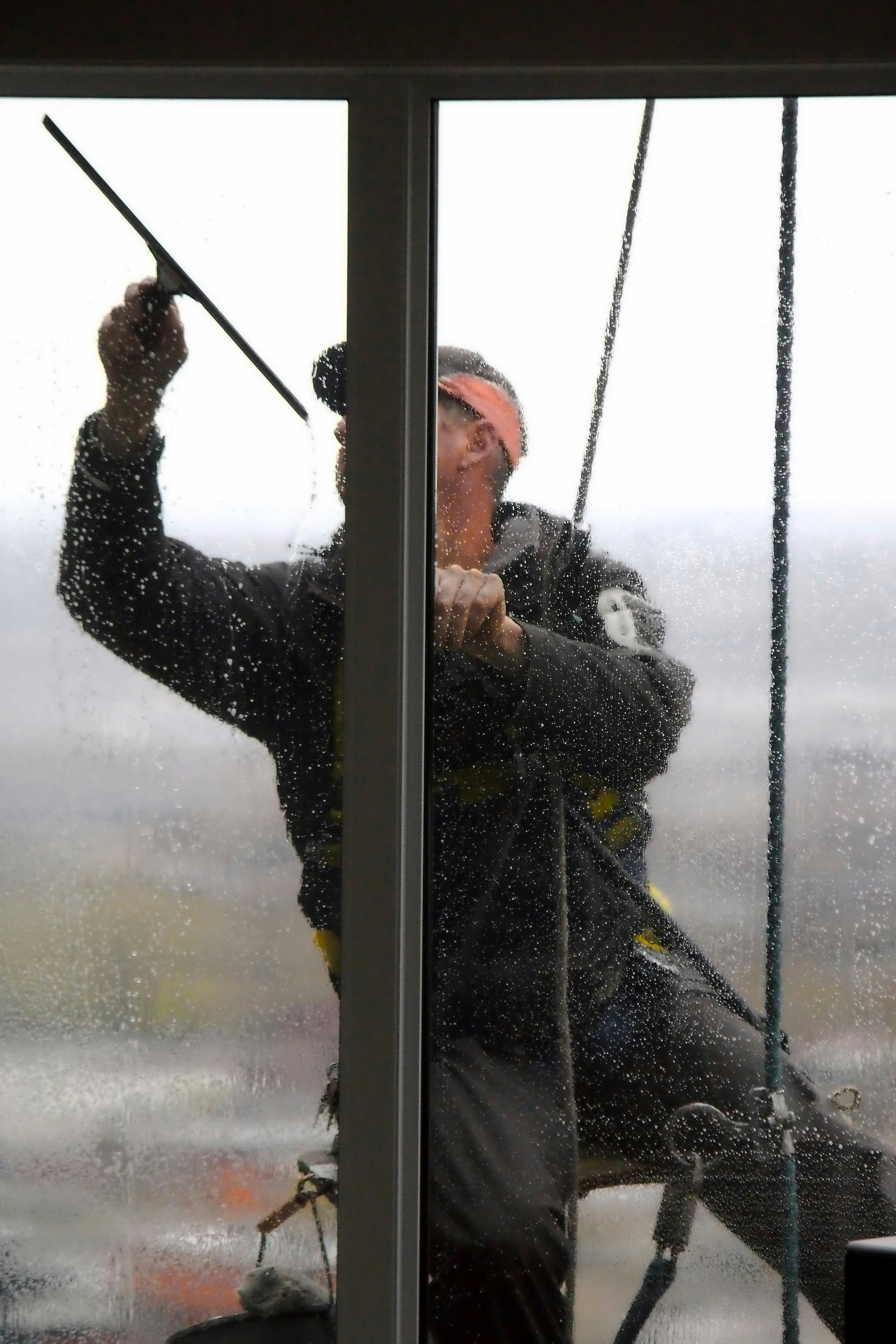 Professional window cleaning in action