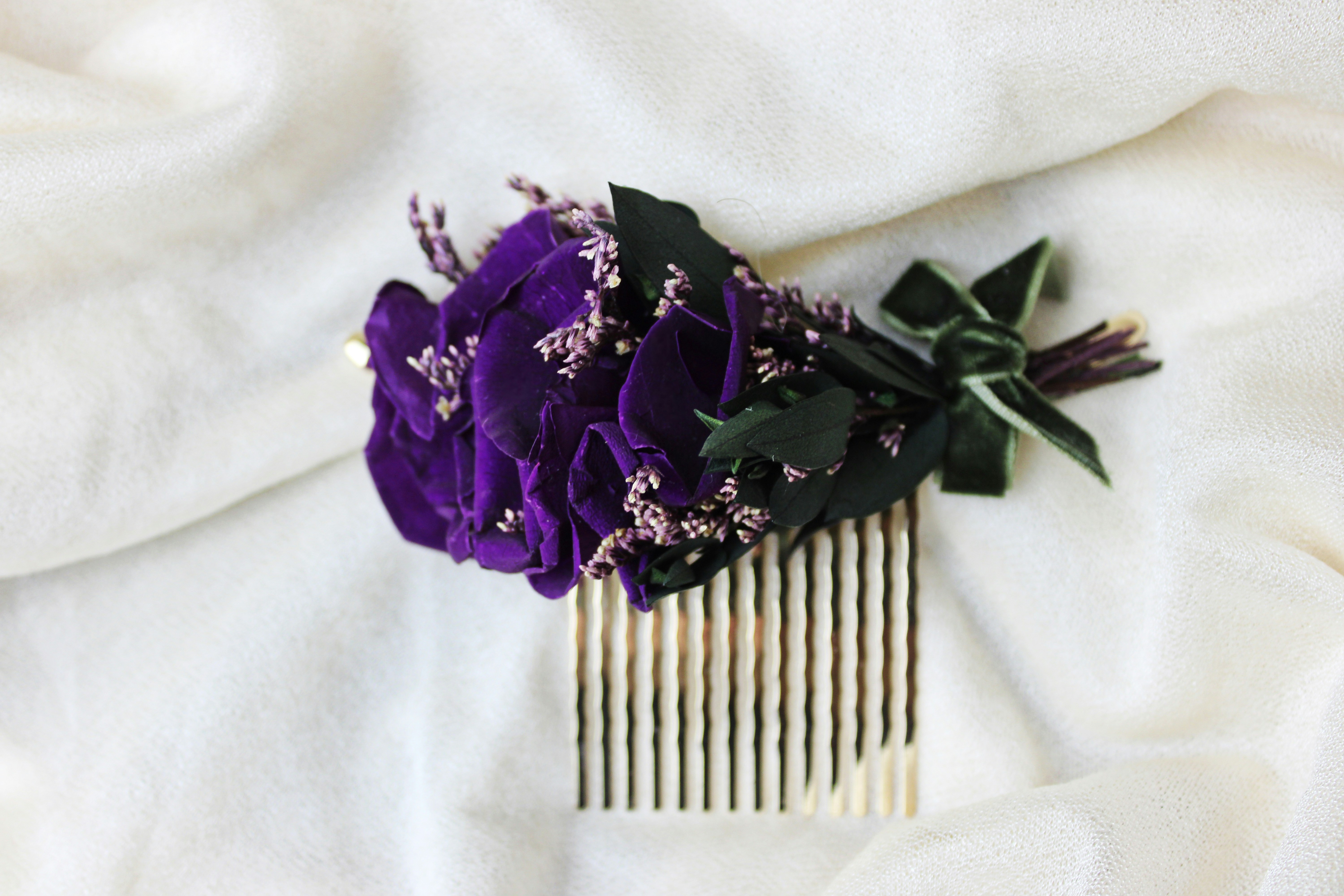 A beautiful purple floral hair comb.