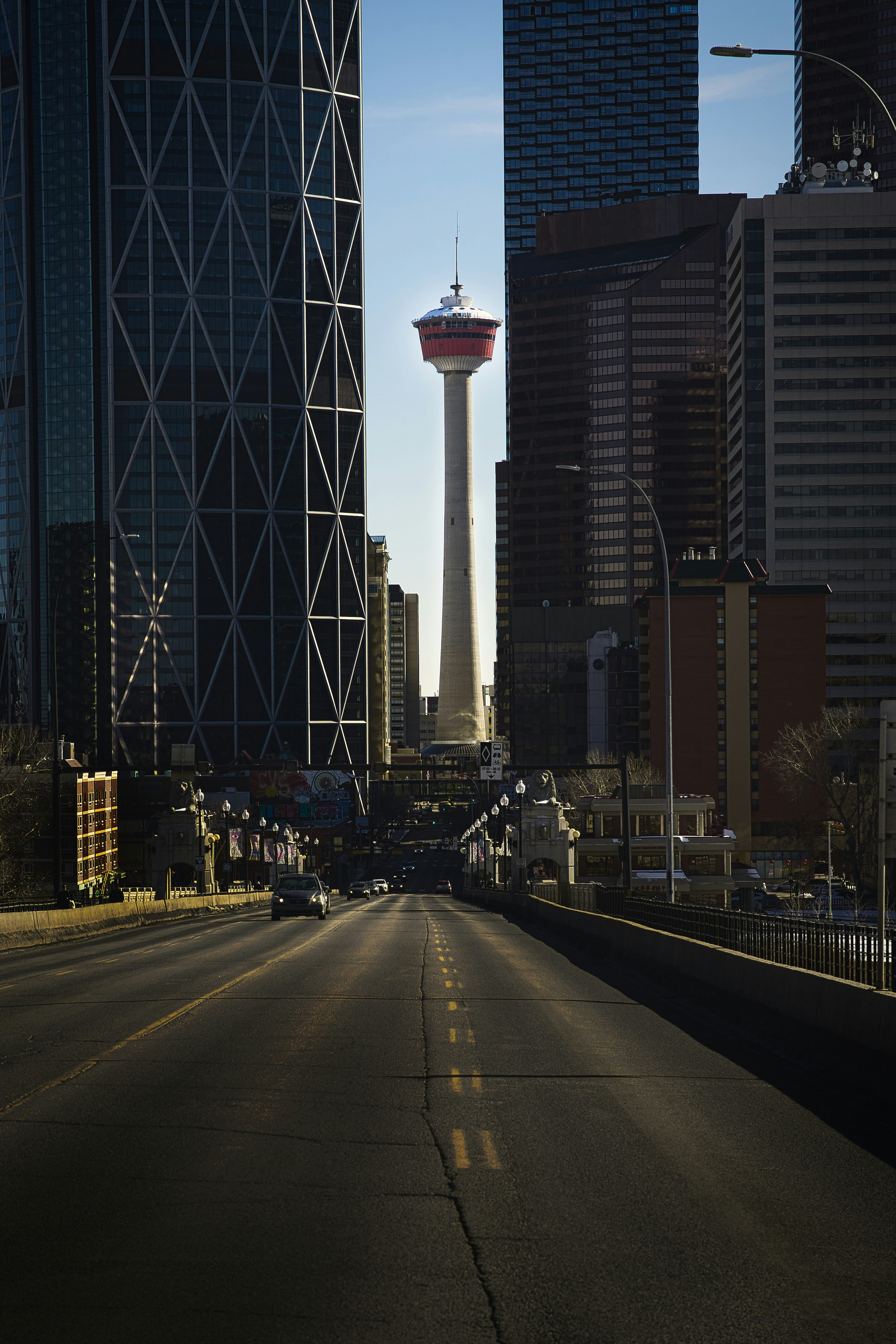 Road leads to the calgary tower in the city.