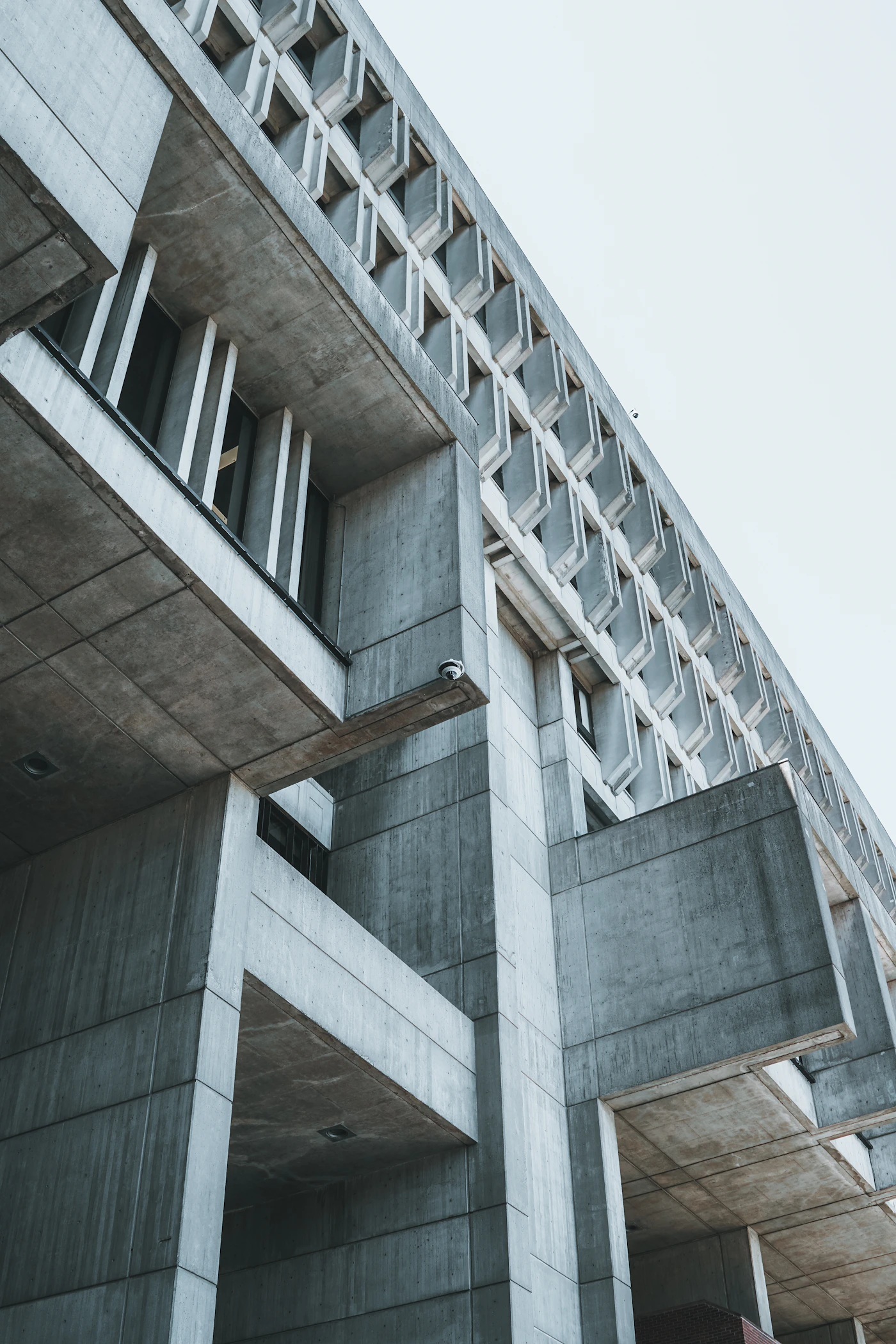 Repeating concrete architectural forms with strong lines and shadows