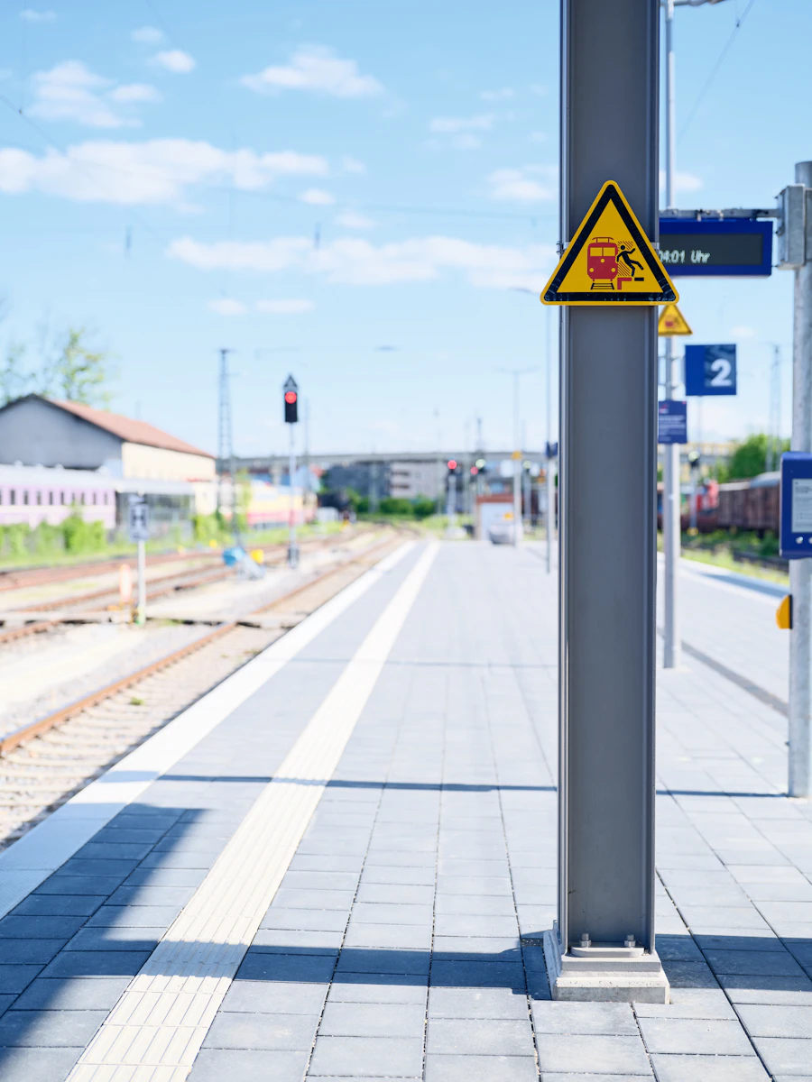 Train station platform with warning sign