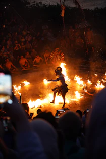 A balinese dancer performs in a fire ceremony.