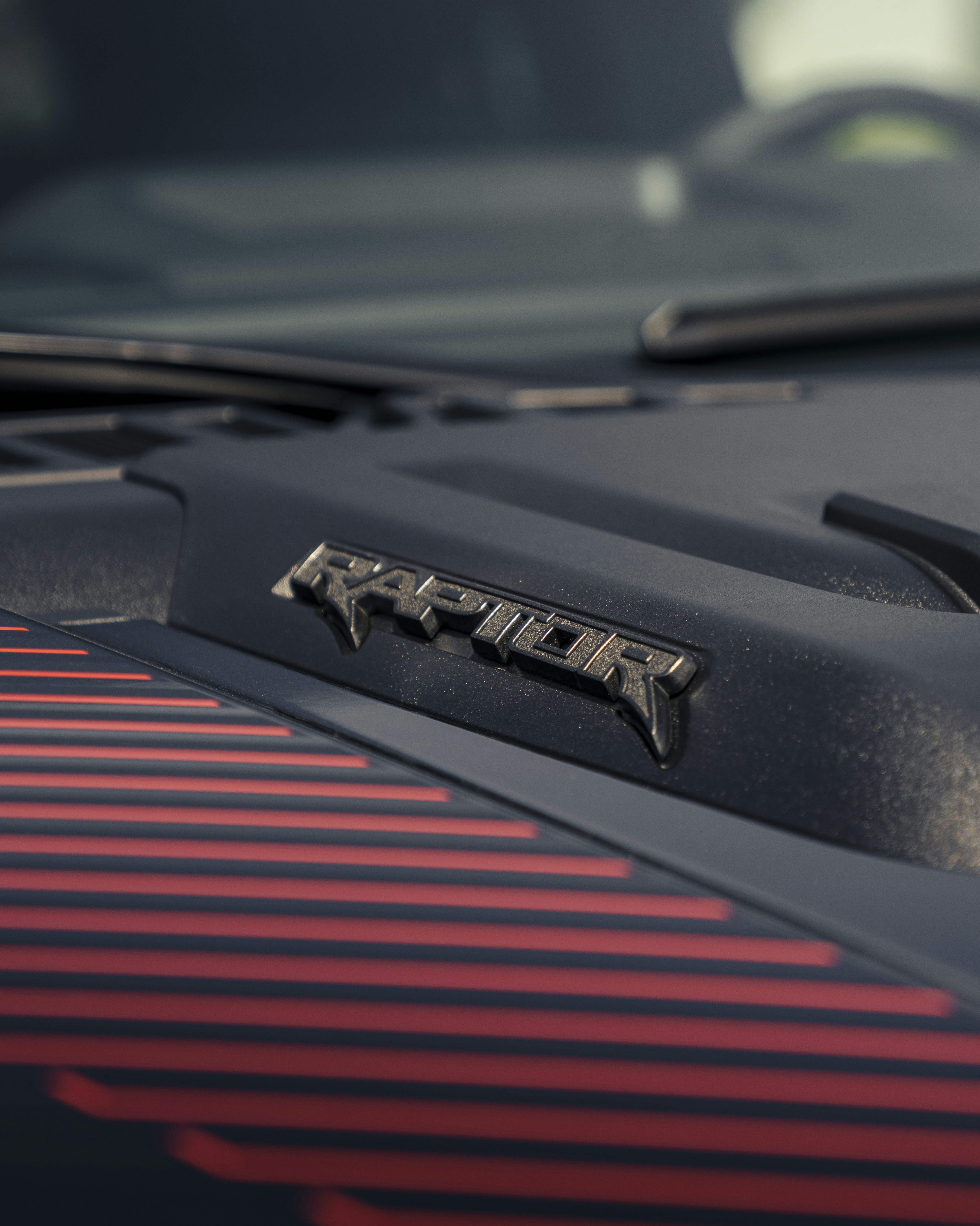 Ford raptor logo close-up shot on the car.