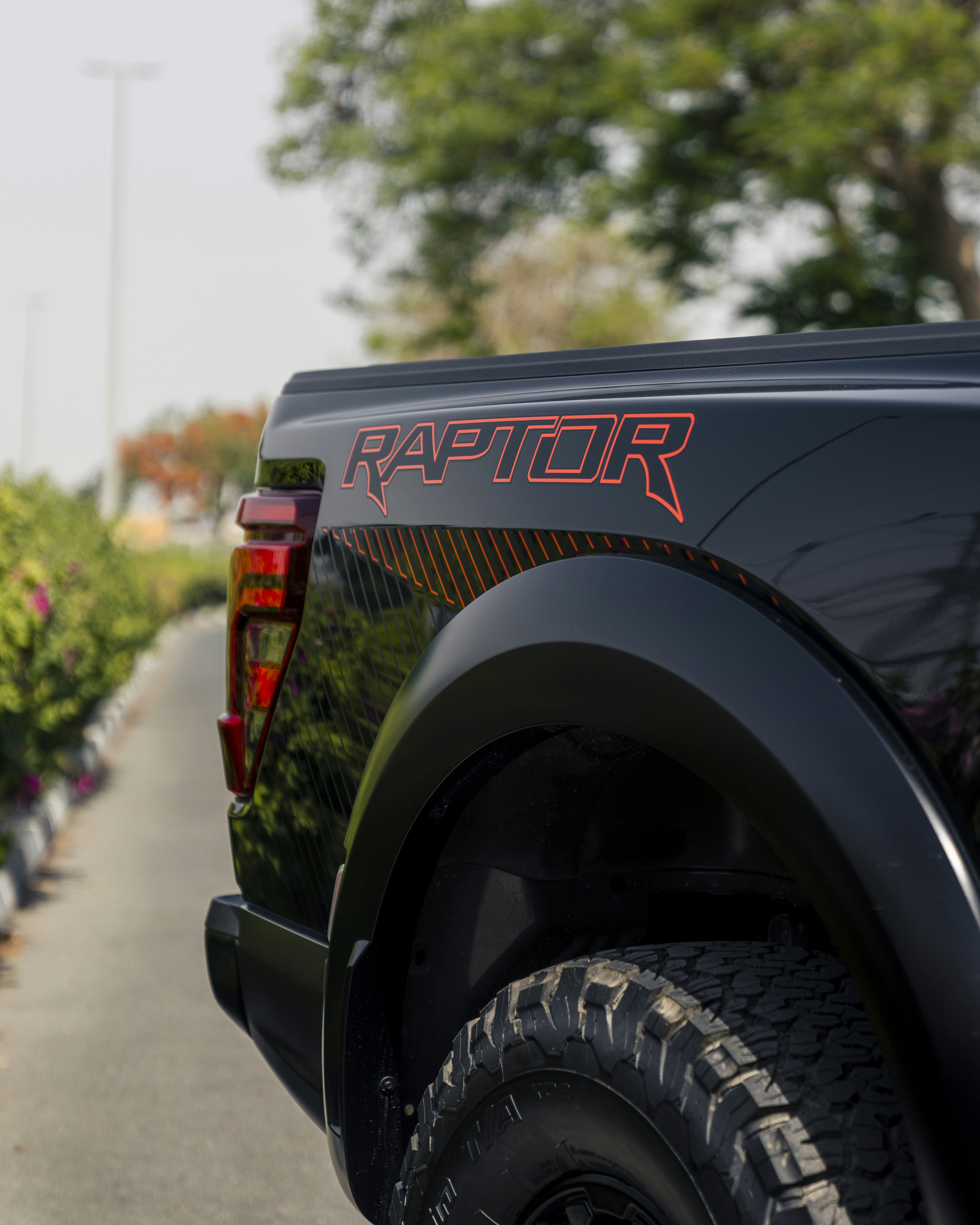 The ford raptor pickup truck is on display.