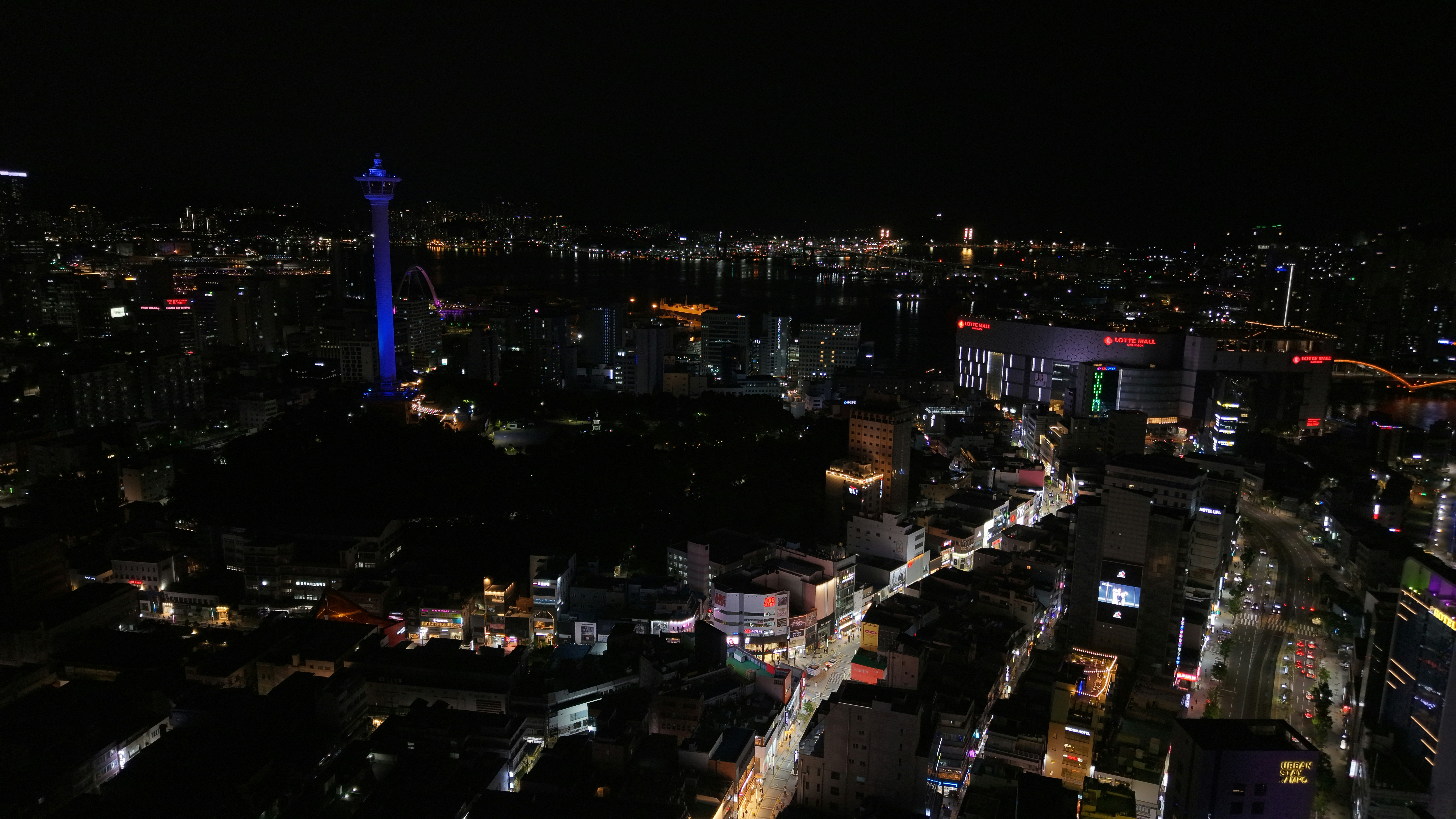 City lights illuminate the night sky.