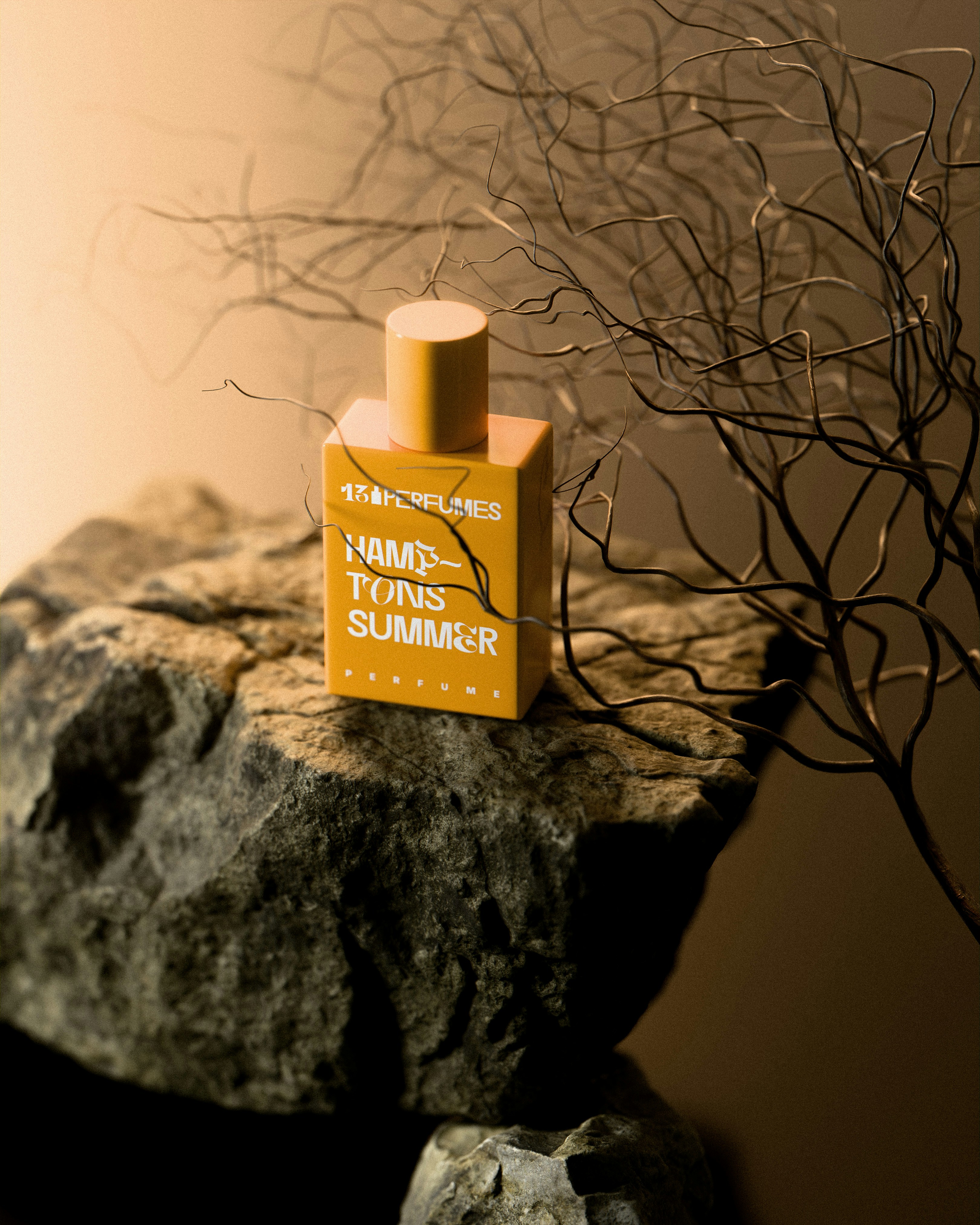 A perfume bottle sits atop a rugged rock.
