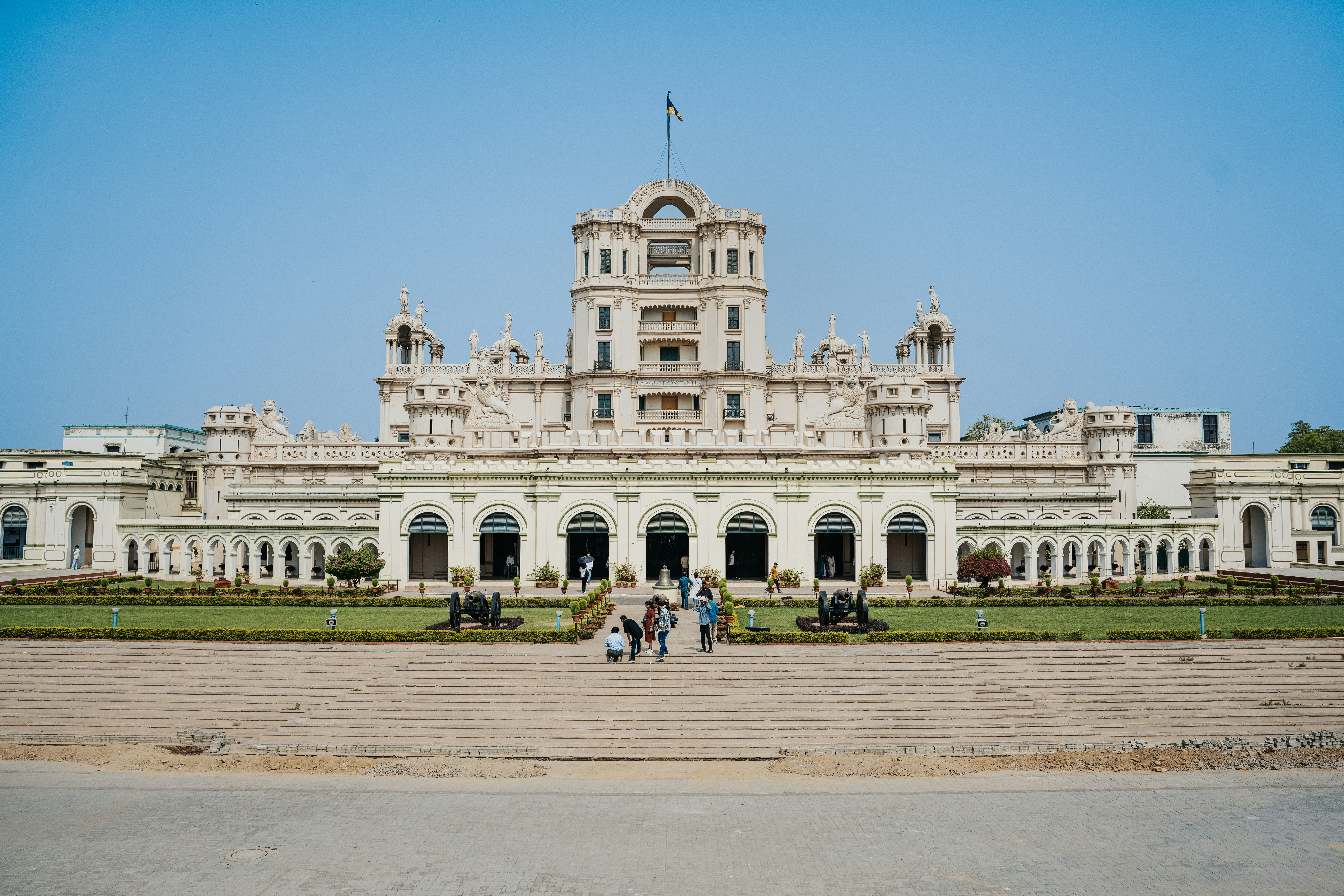 A grand palace stands proudly under a blue sky.