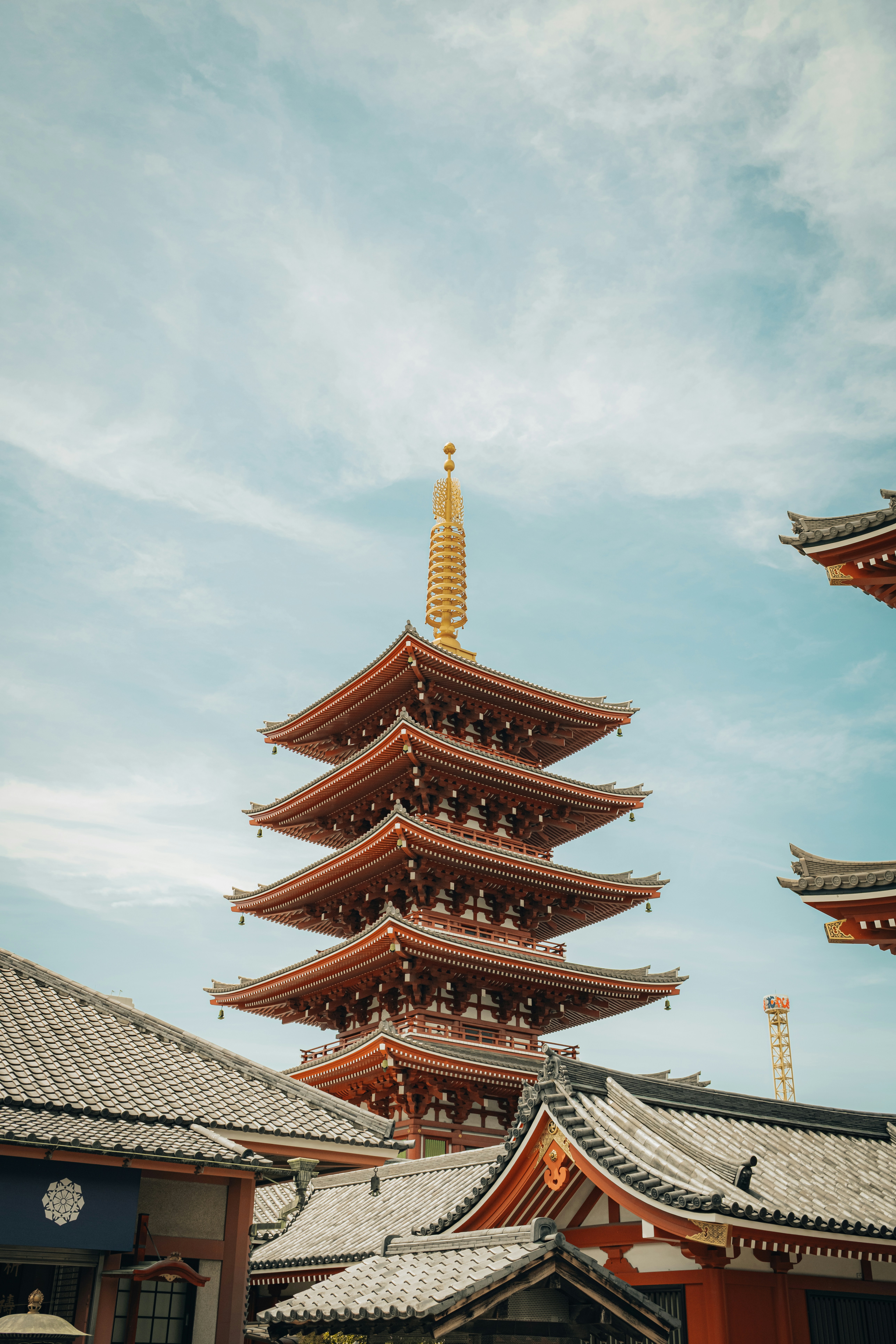 A pagoda stands tall beneath a cloudy sky.