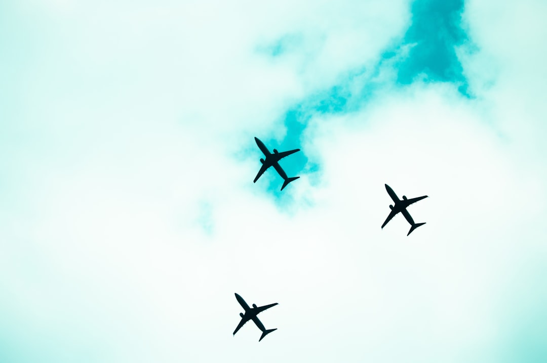 Three airplanes fly high in the sky., aerial training of three planes