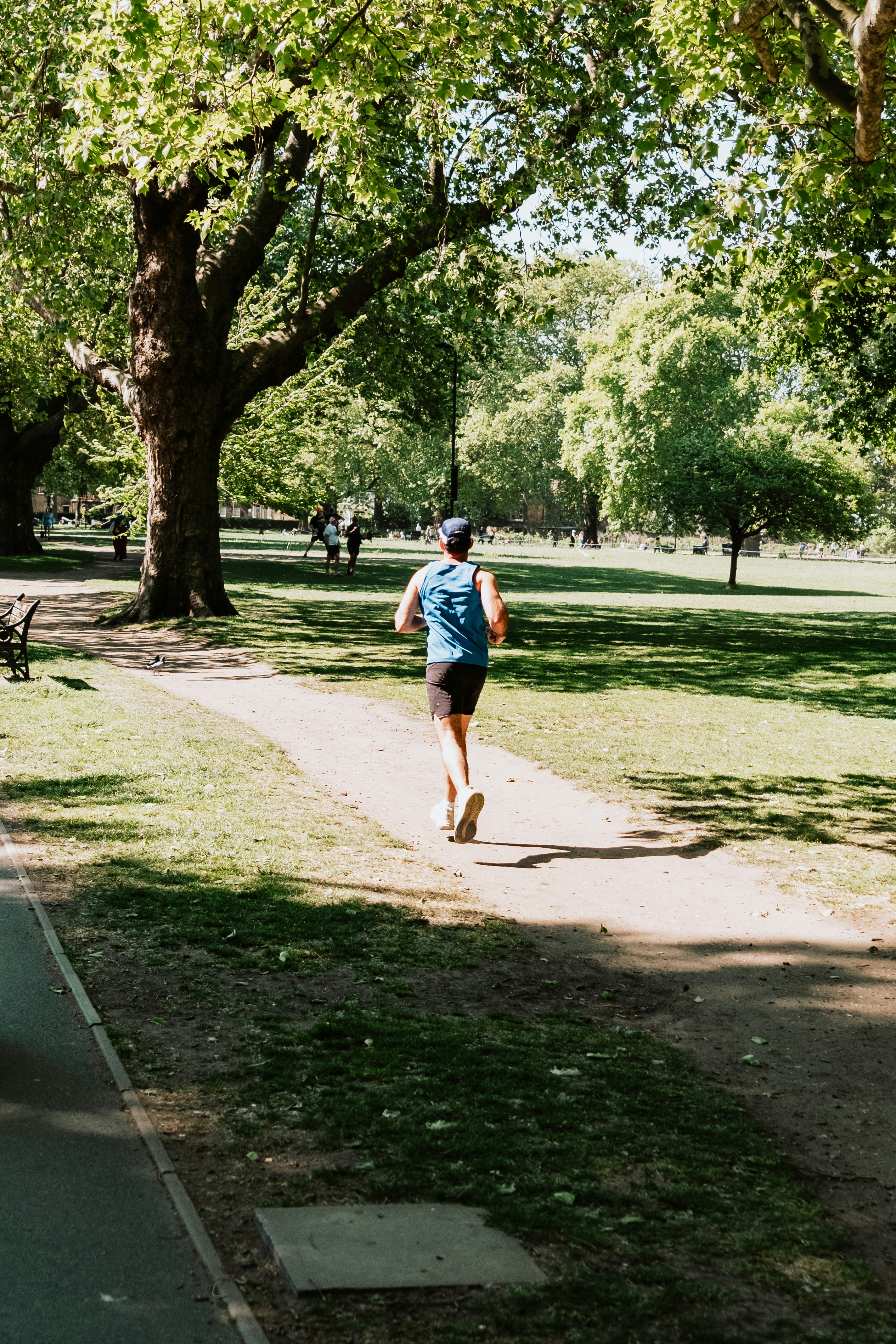 Runner enjoys a sunny day in the park.