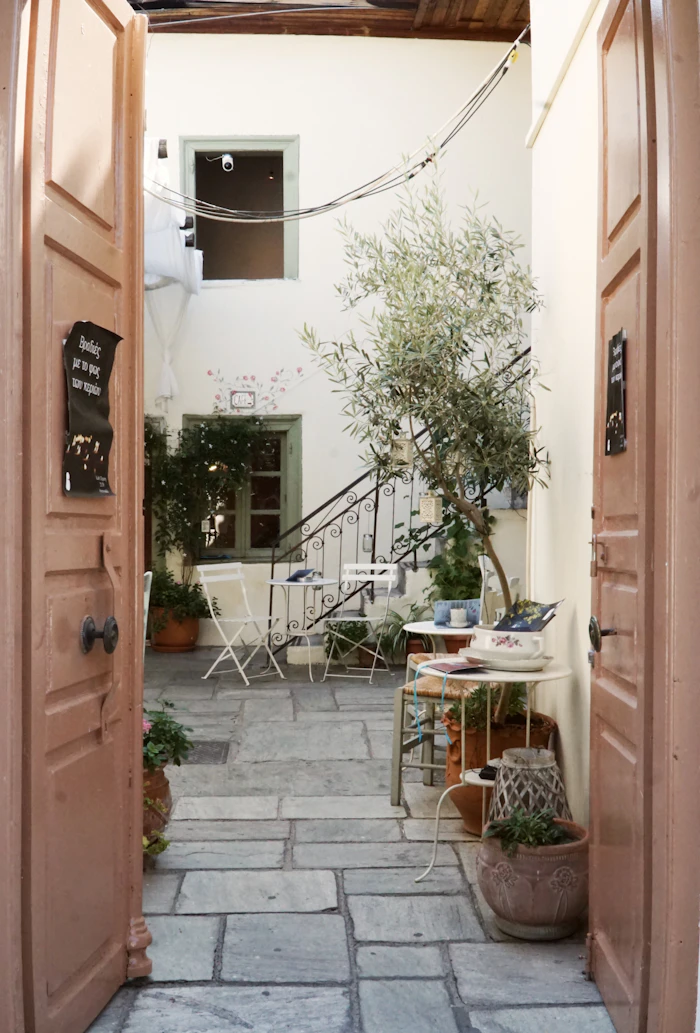 A cosy courtyard framed by open doors
