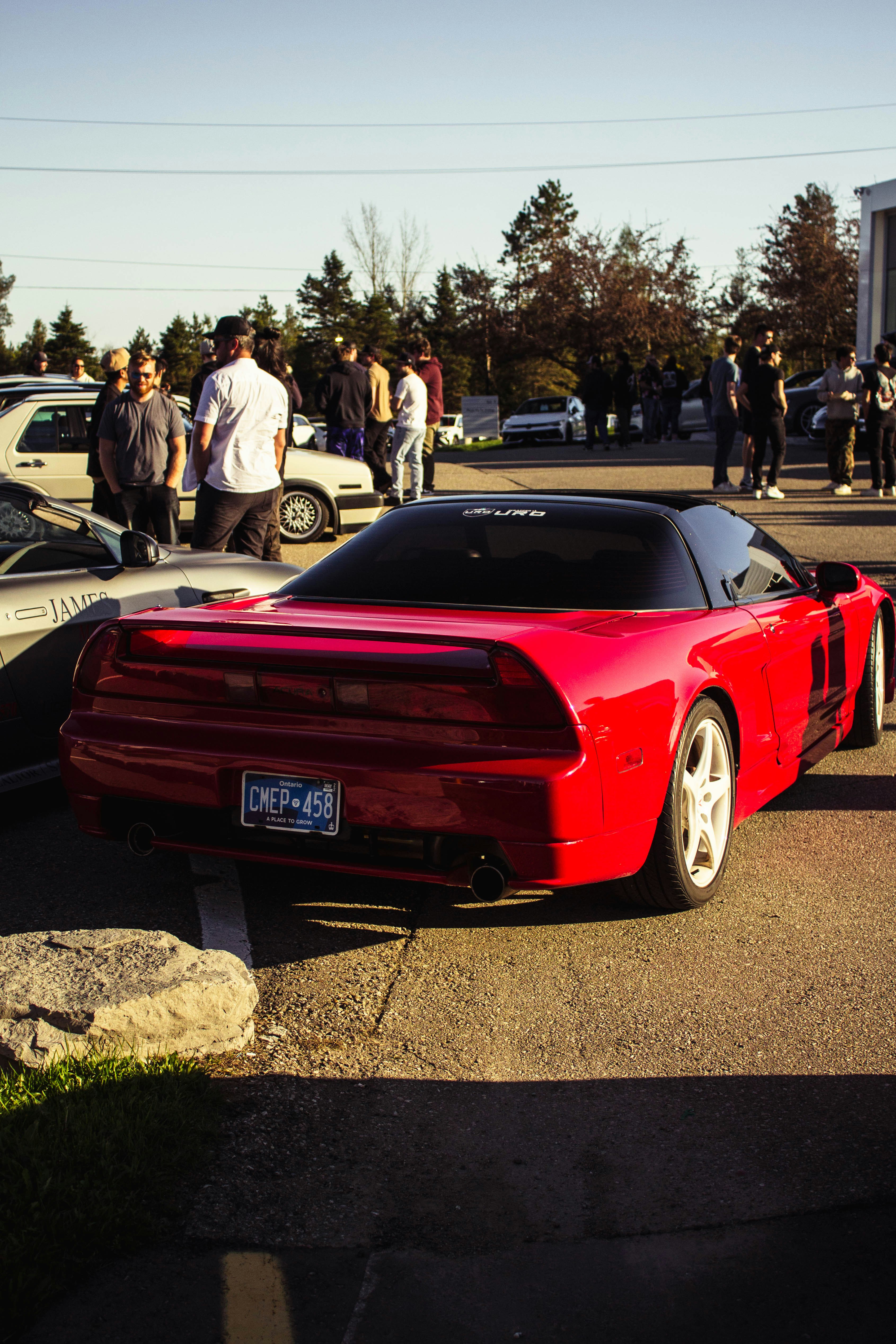 A red sports car is parked at a car show. photo – Free Honda Image on ...