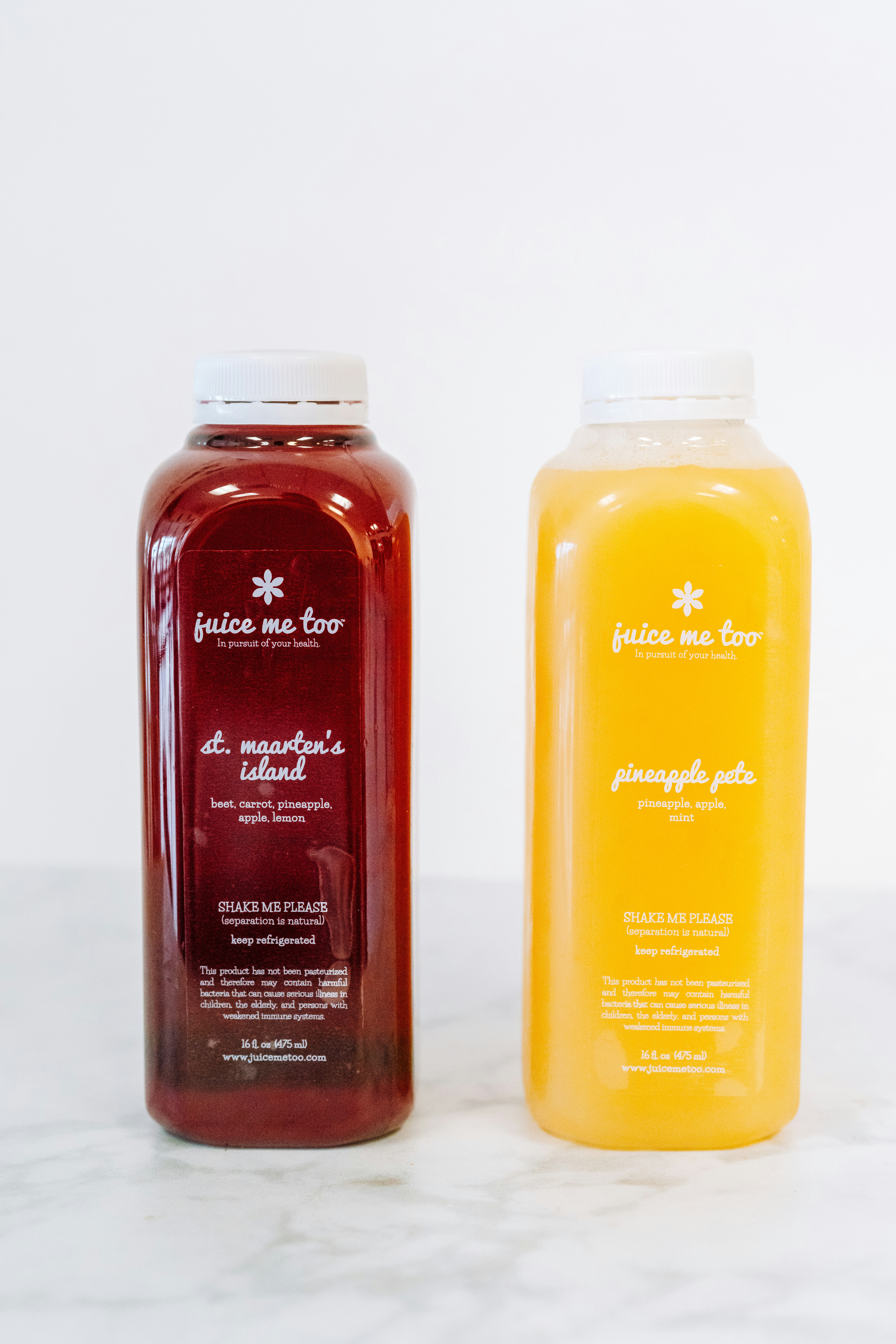 Two bottles of juice: one red, one yellow.
