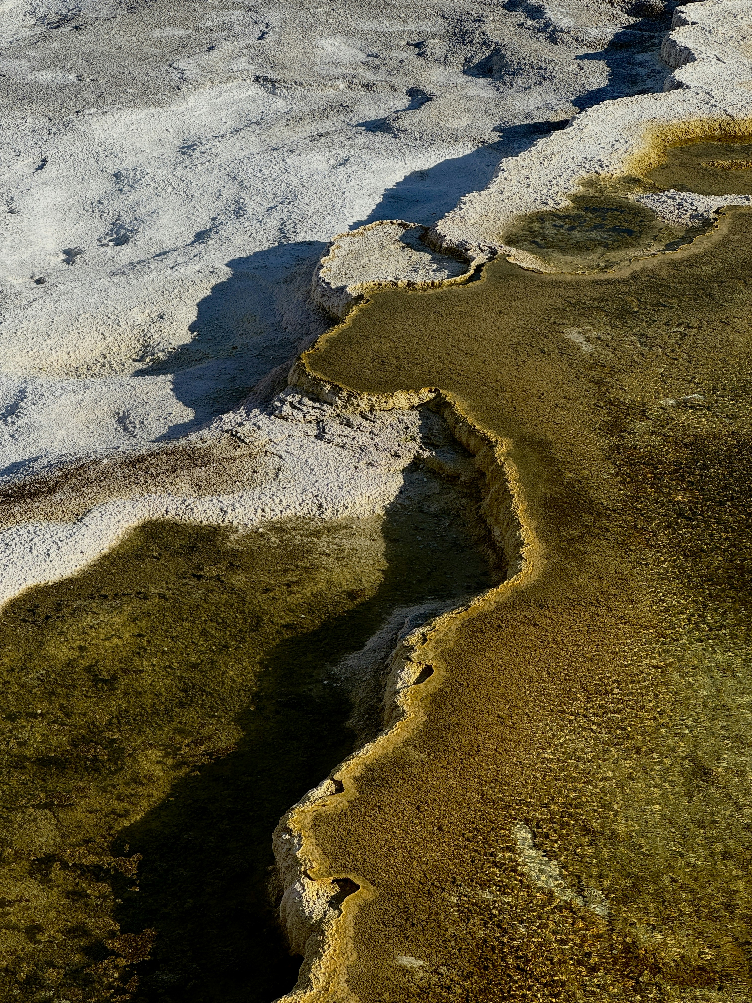 Thermal springs create striking, colorful patterns.