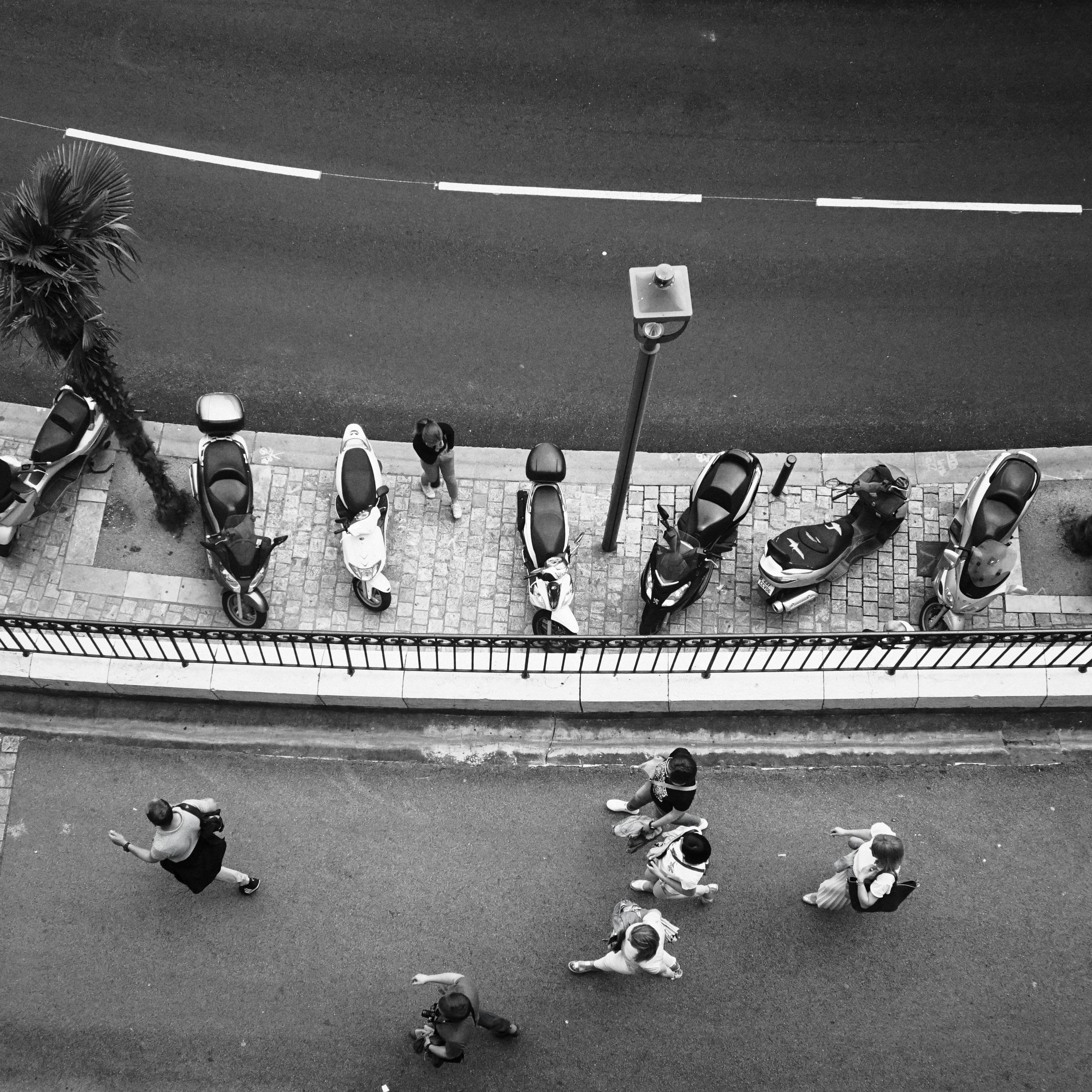 Motorcycles and people are seen from above.