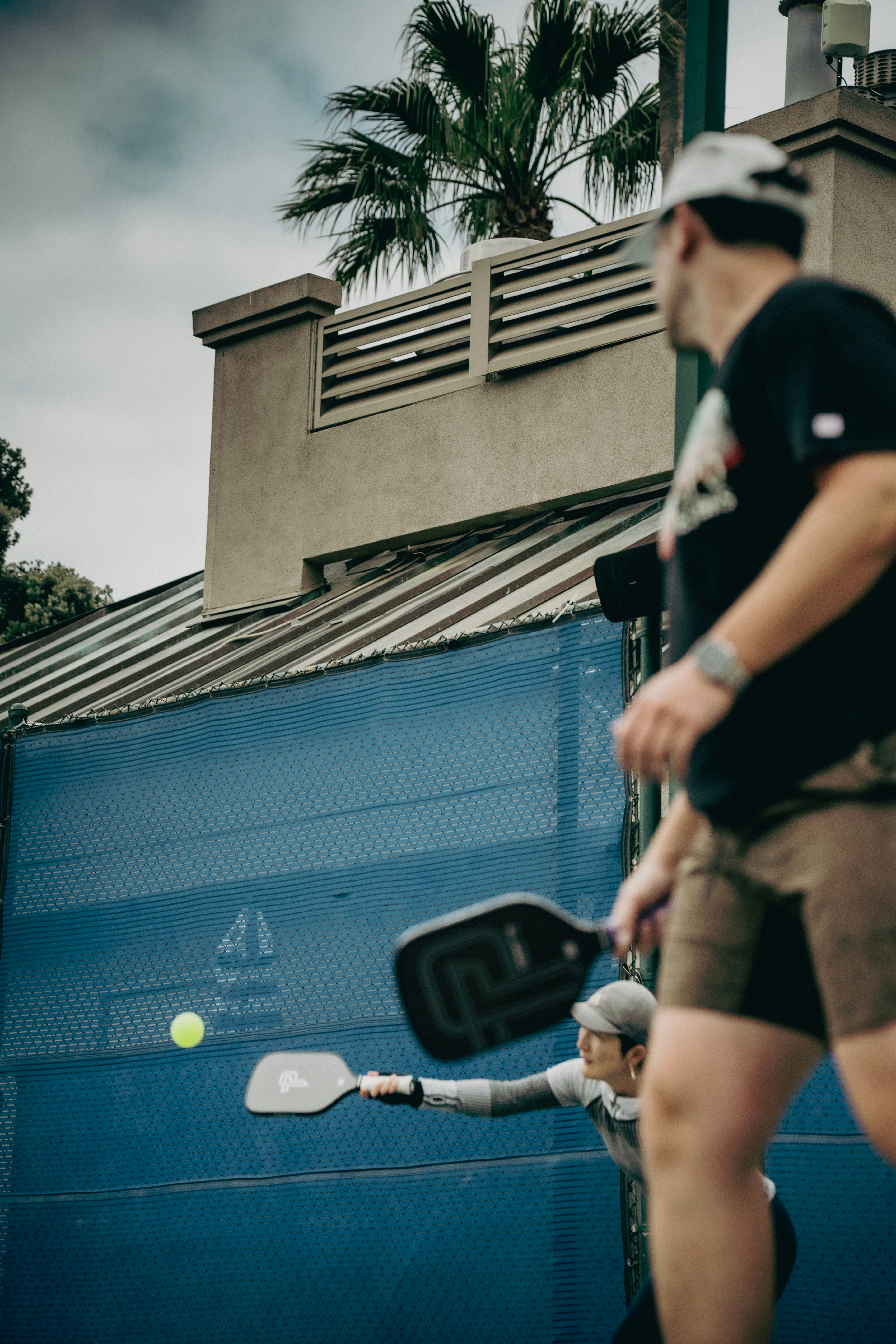 Pickleball players on an outdoor court