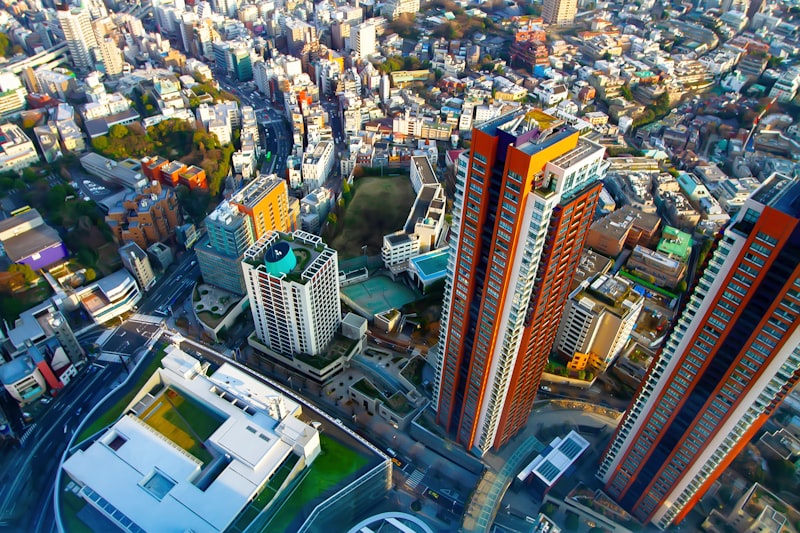 Tokyo business district, stock market display, office workers, financial charts, skyscrapers