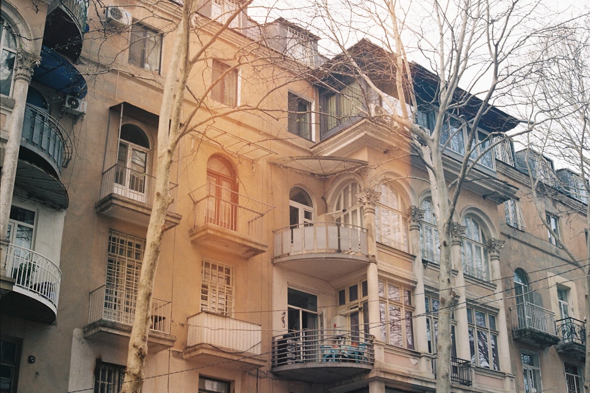 Houses under clouds in old Tbilisi, Georgia, with the city's distinctive coloured architecture