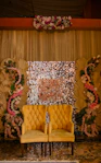 Decorated backdrop with two chairs for an event