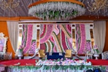 A stage decorated with flowers for a special event.