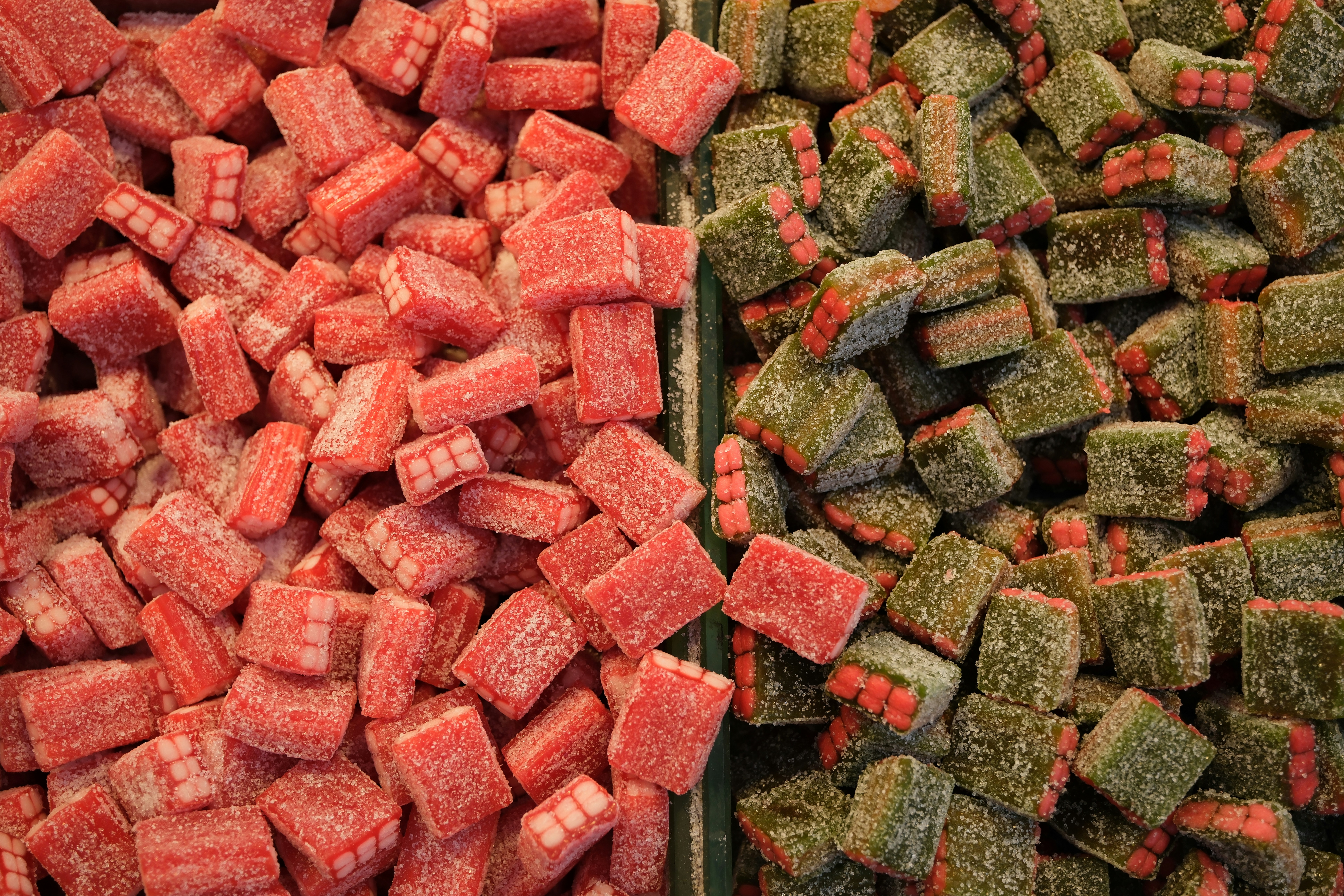 Red and green candies displayed side by side.