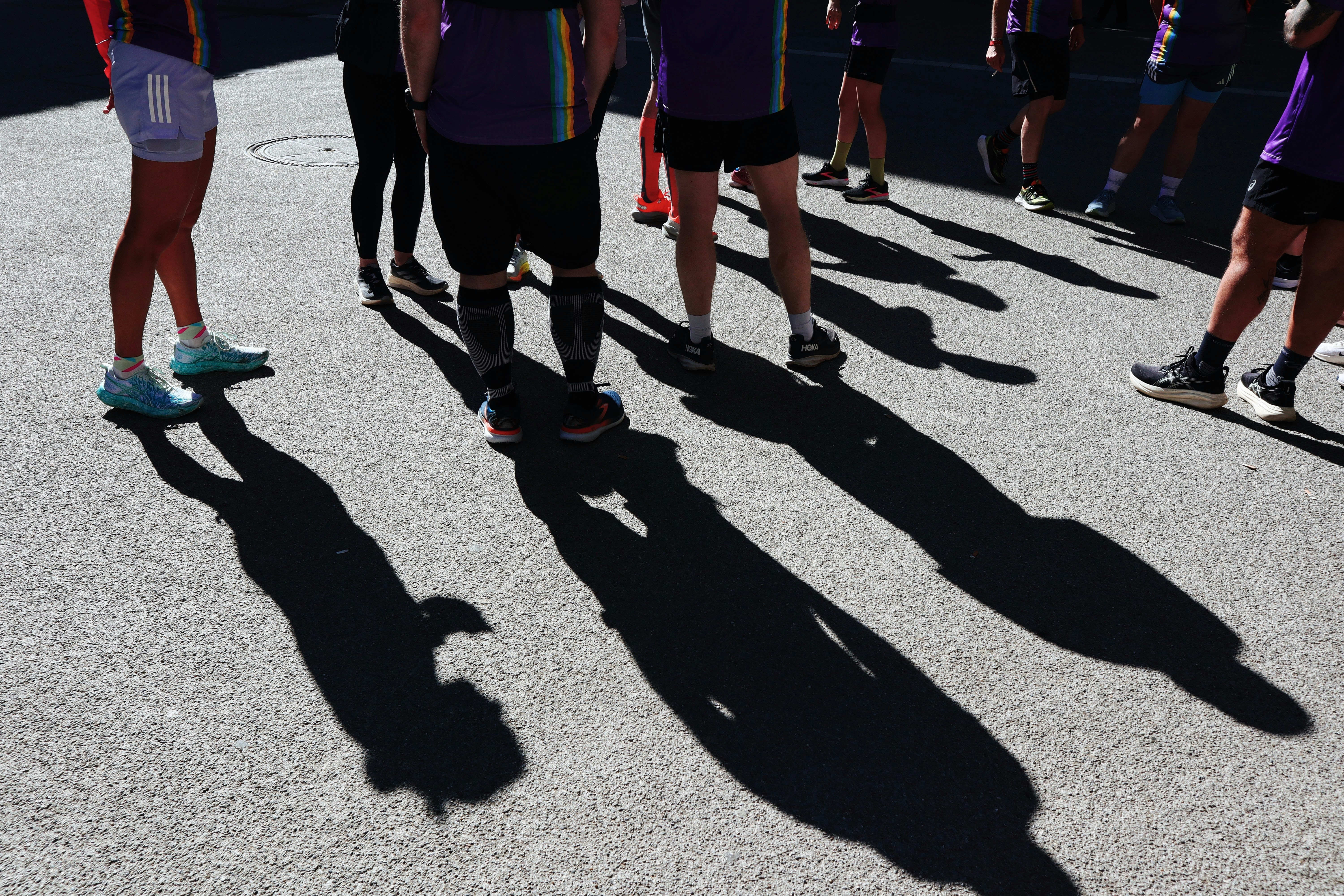 People and shadows in sunlight