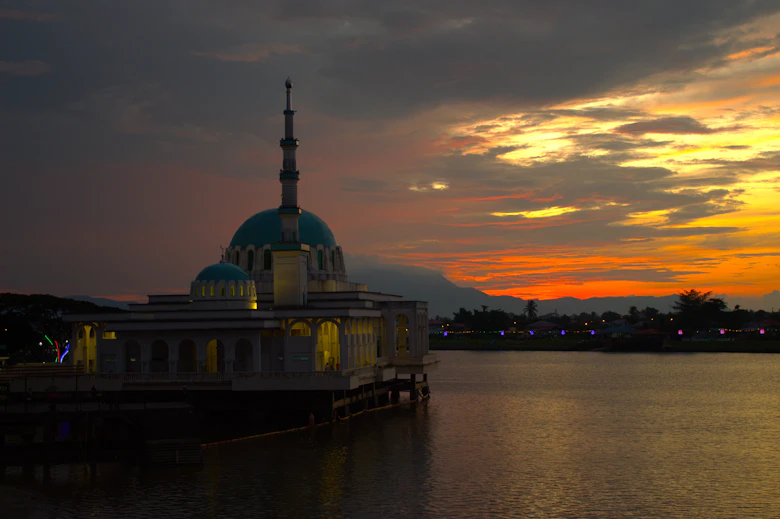 Mosque silhouettes at sunset along Kuching Waterfront