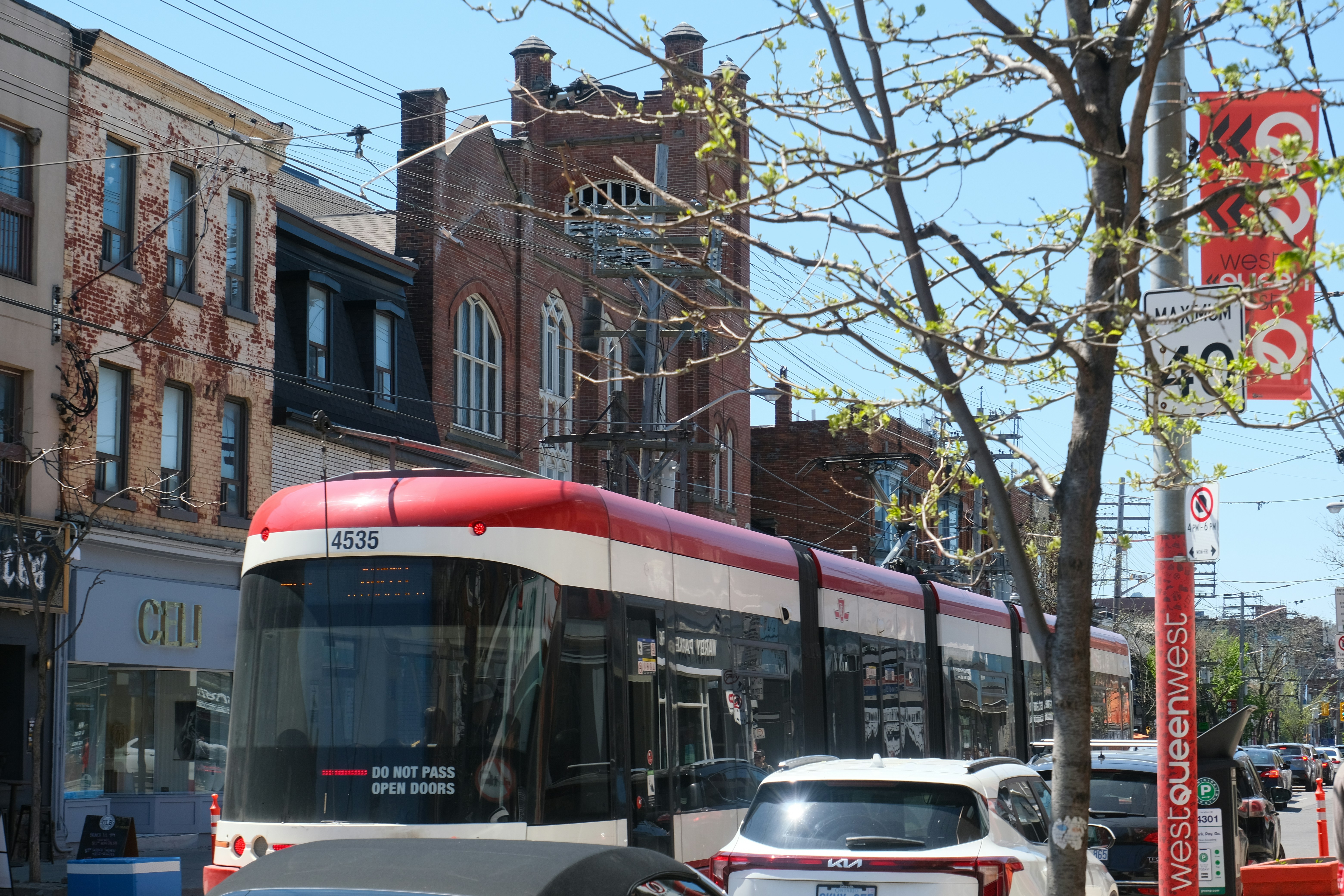 QLine streetcar in downtown Detroit with passengers boarding - detroit vacation rentals
