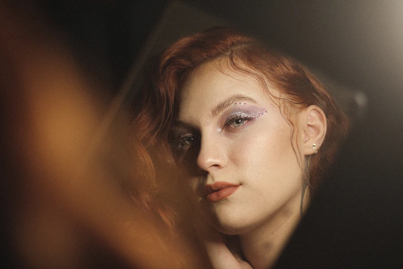 Confident redhead woman looking into camera