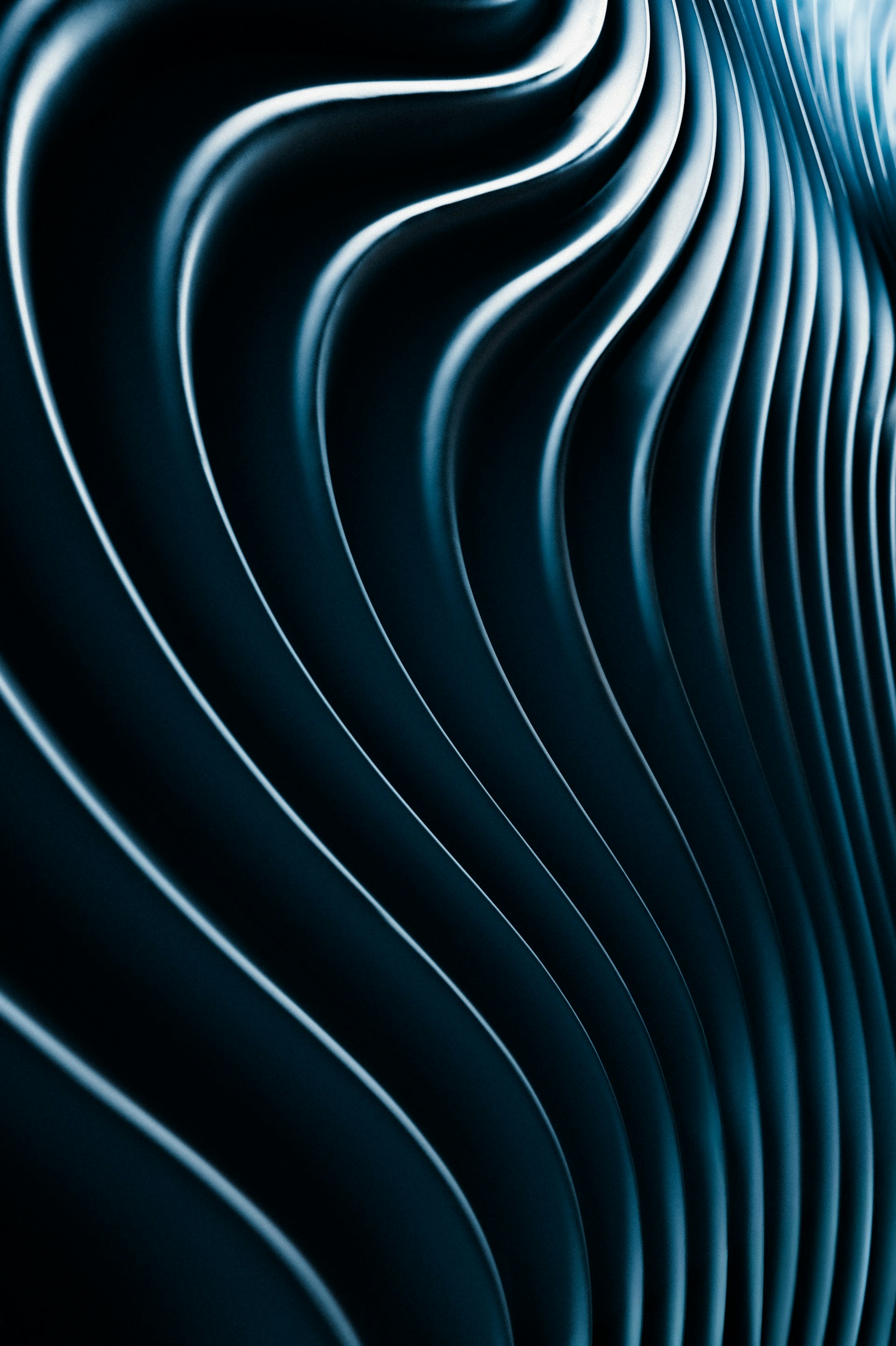 Abstract, wavy lines in a blue, metallic hue.