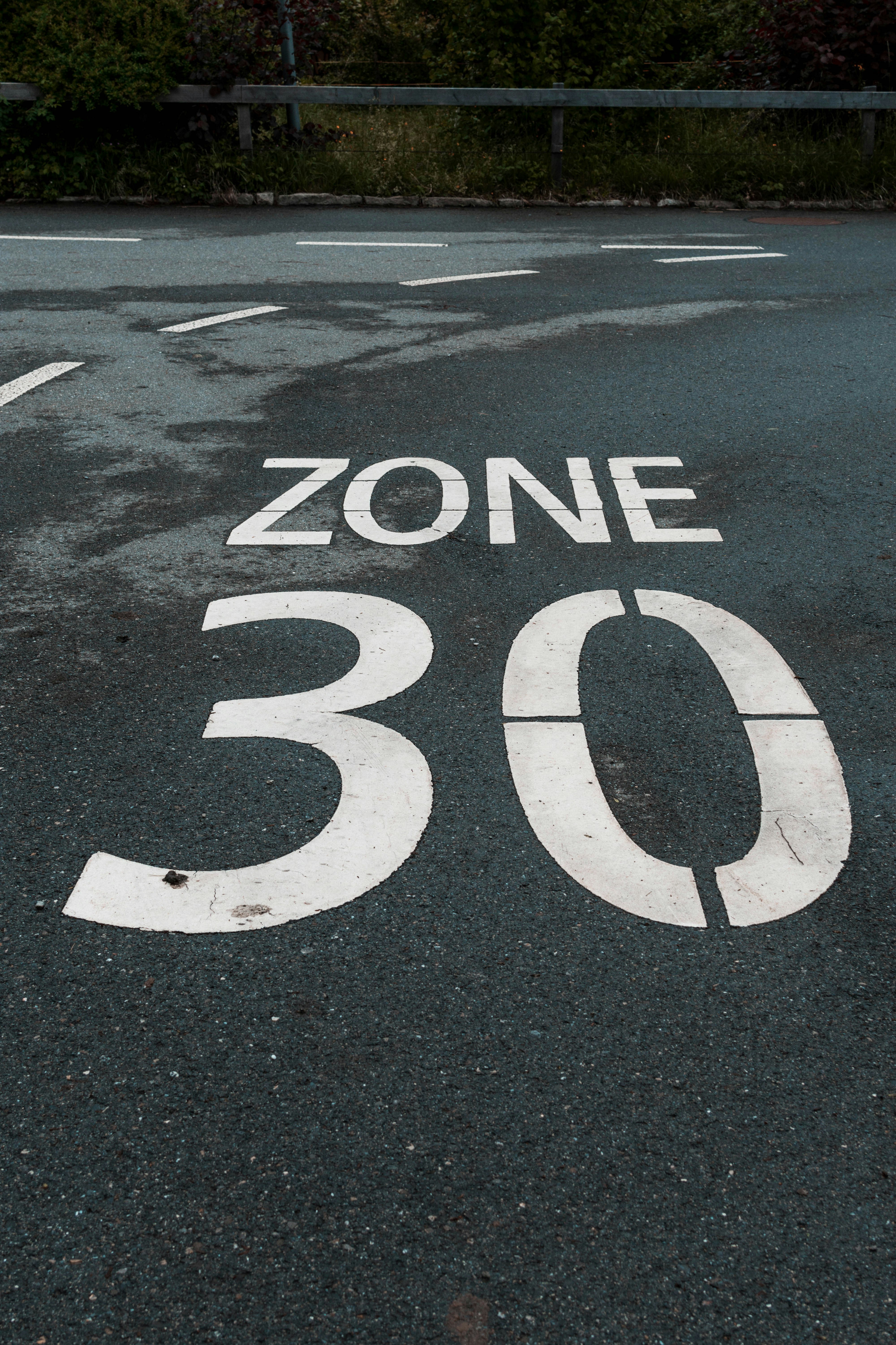 Zone 30 speed limit sign painted on the road