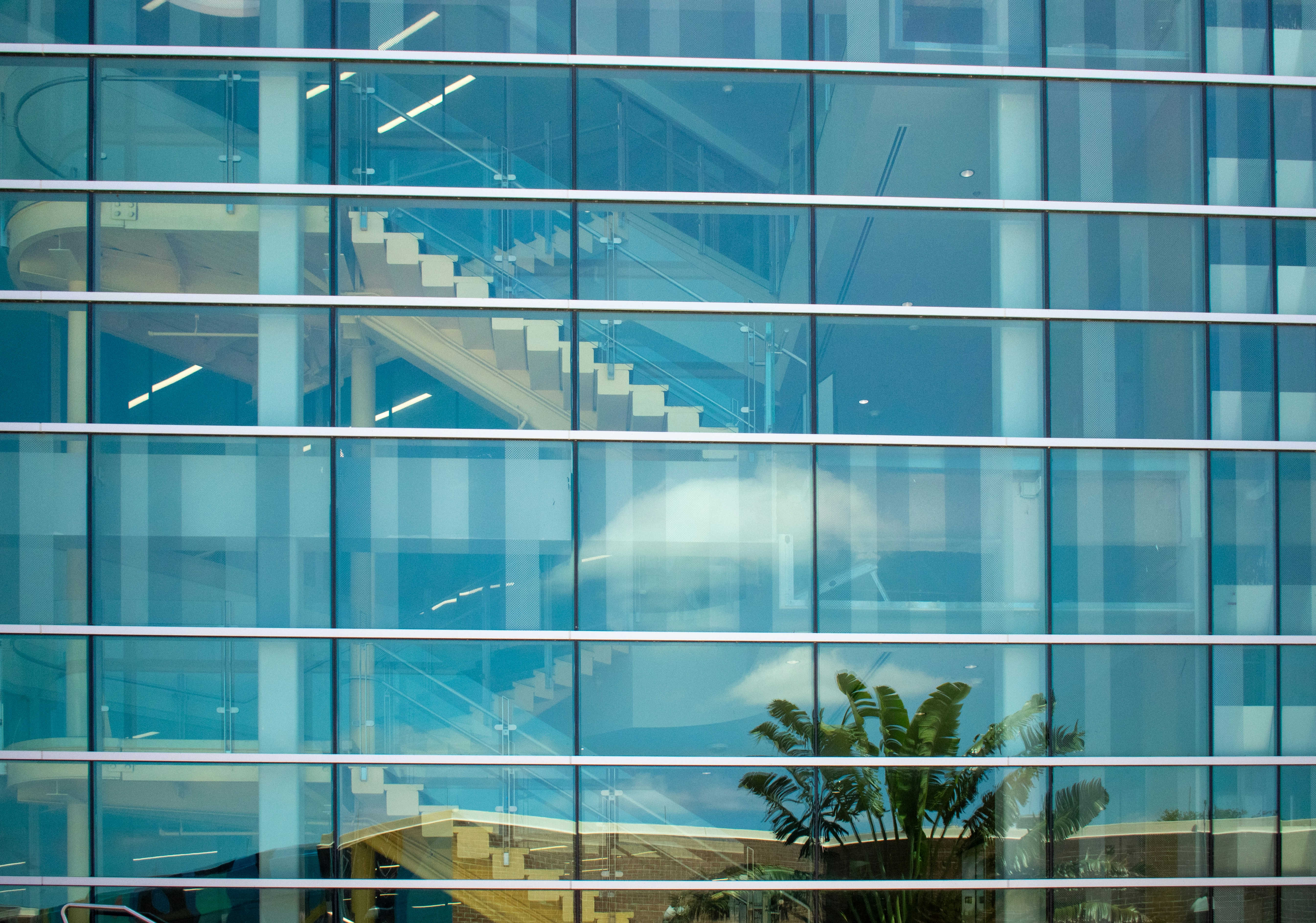 Glass building reflecting the surroundings.