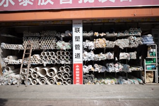 A storefront displays a variety of pipes.