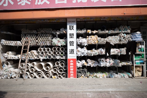 A storefront displays a variety of pipes.