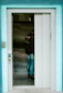 A person waits in an elevator.