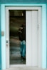 A person waits in an elevator.