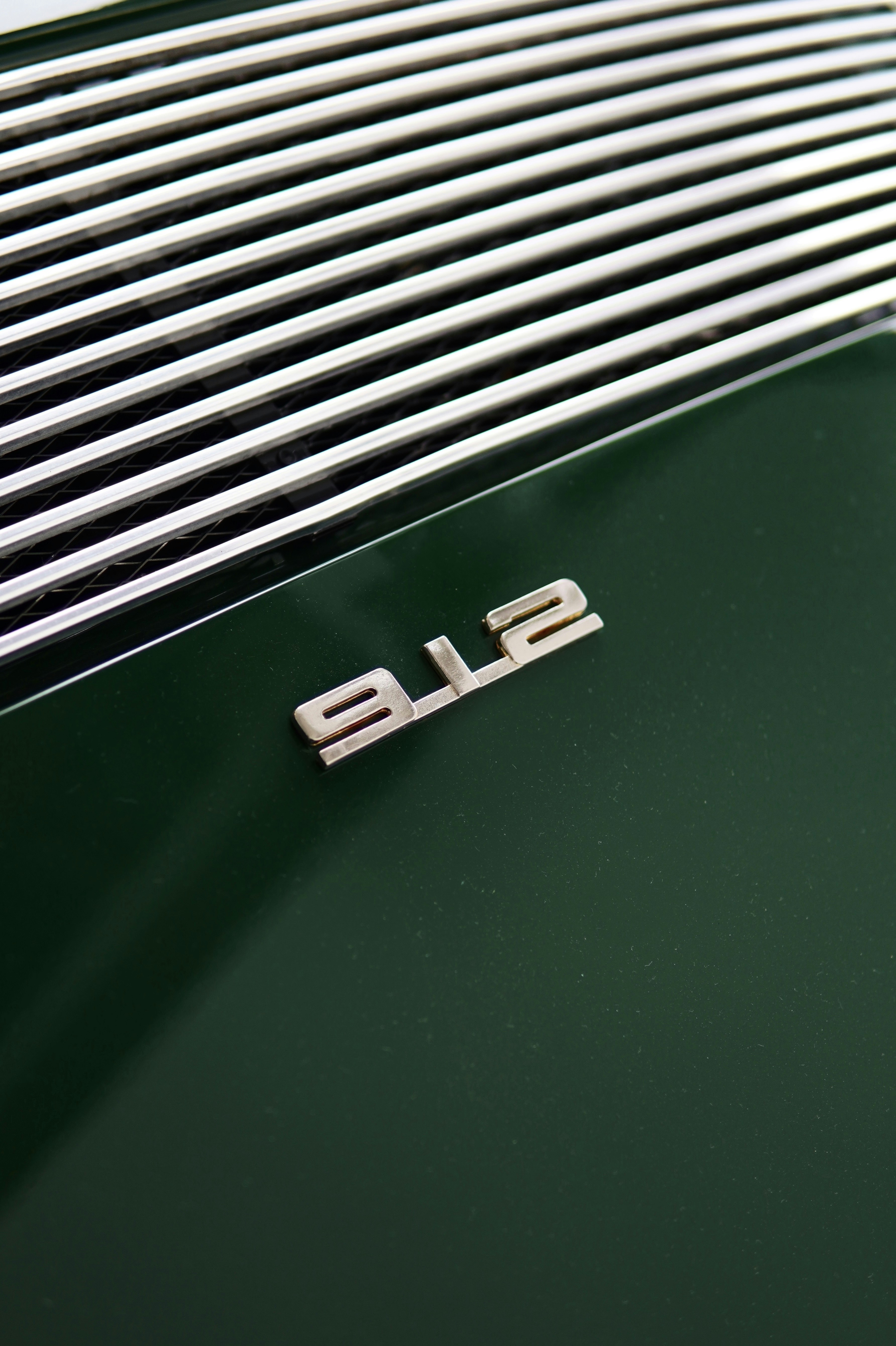 A close-up of a green porsche 911