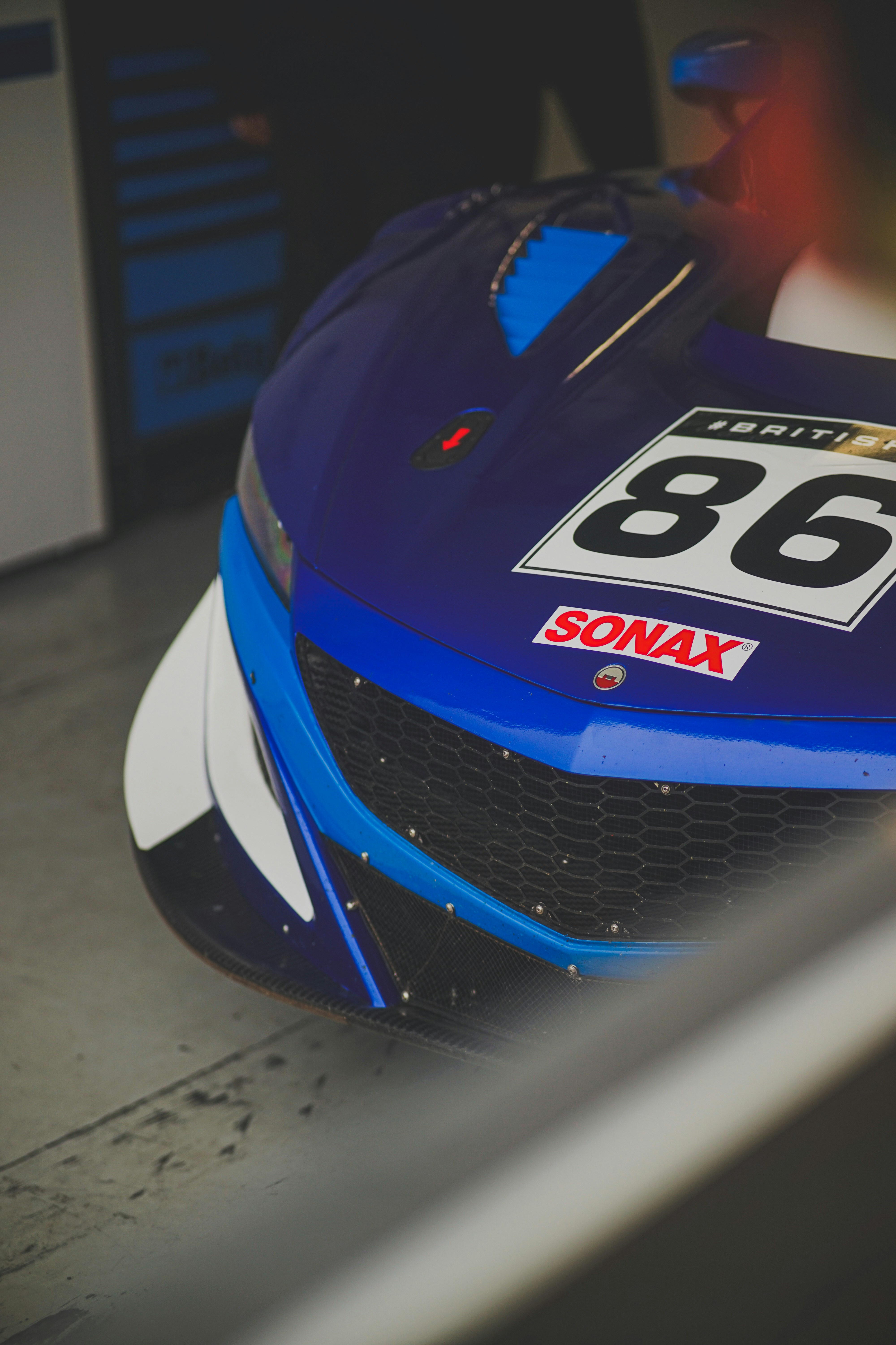 A race car front close-up with number 86. photo – Free Garage Image on ...