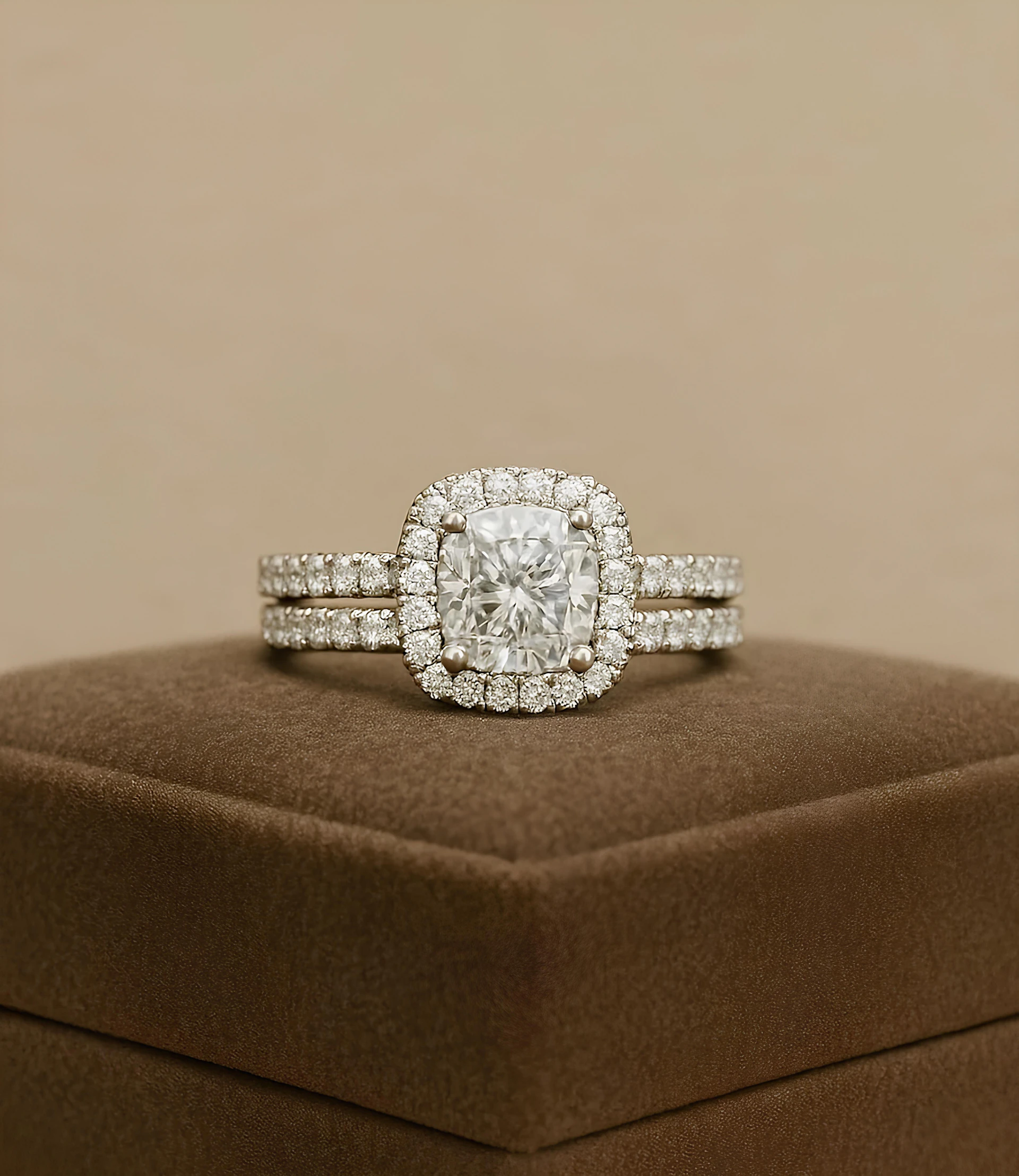 A diamond ring set sits on a display box.