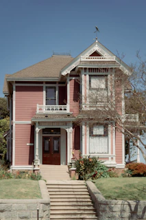A lovely victorian house stands tall and proud.