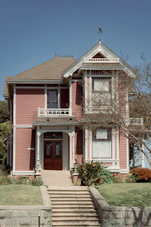 A lovely victorian house stands tall and proud.