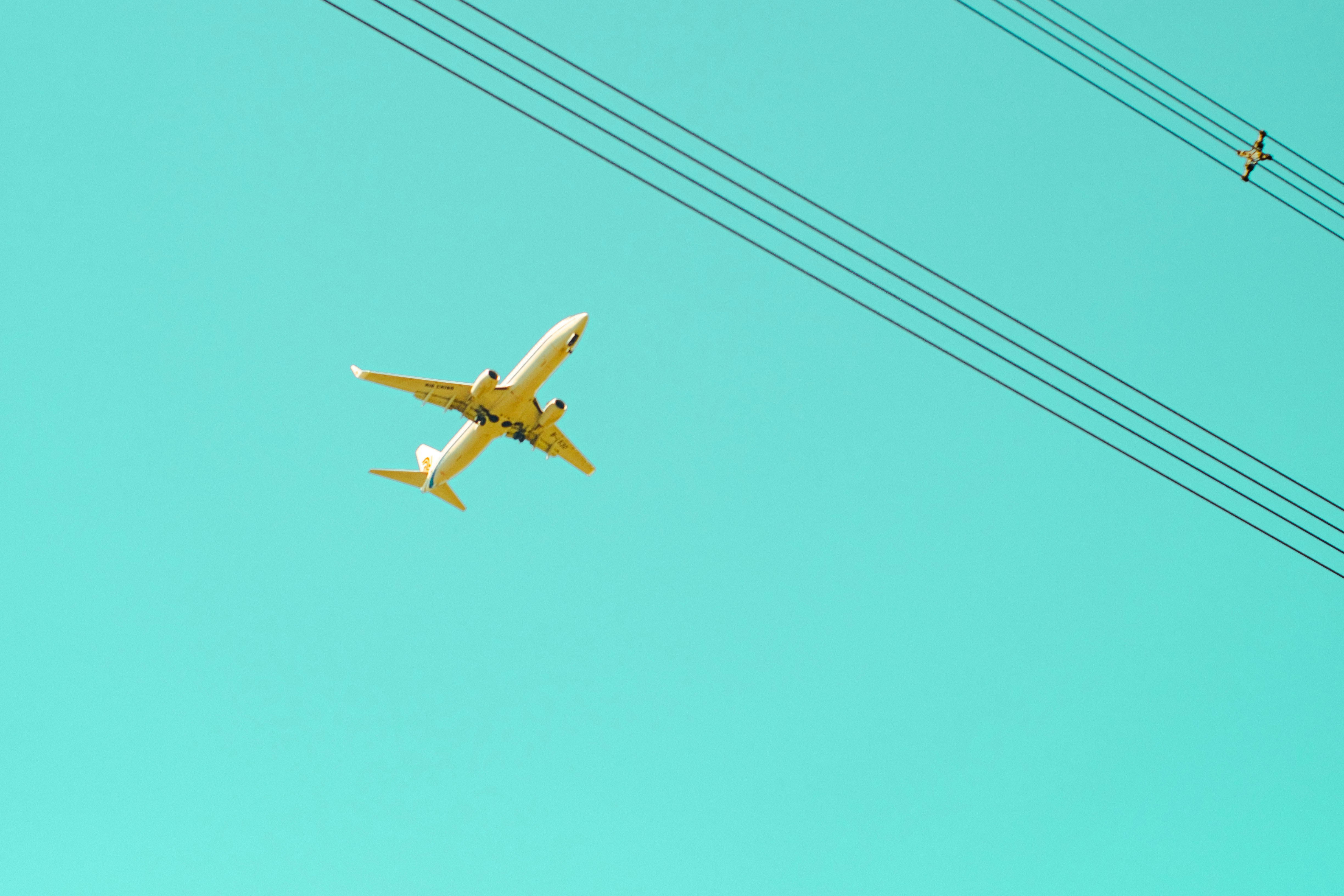 An airplane flies above the sky.