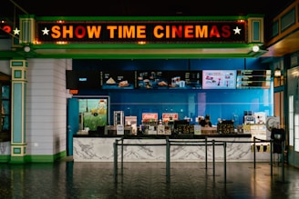 The cinema has a bright "show time" sign.