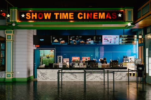 The cinema has a bright "show time" sign.