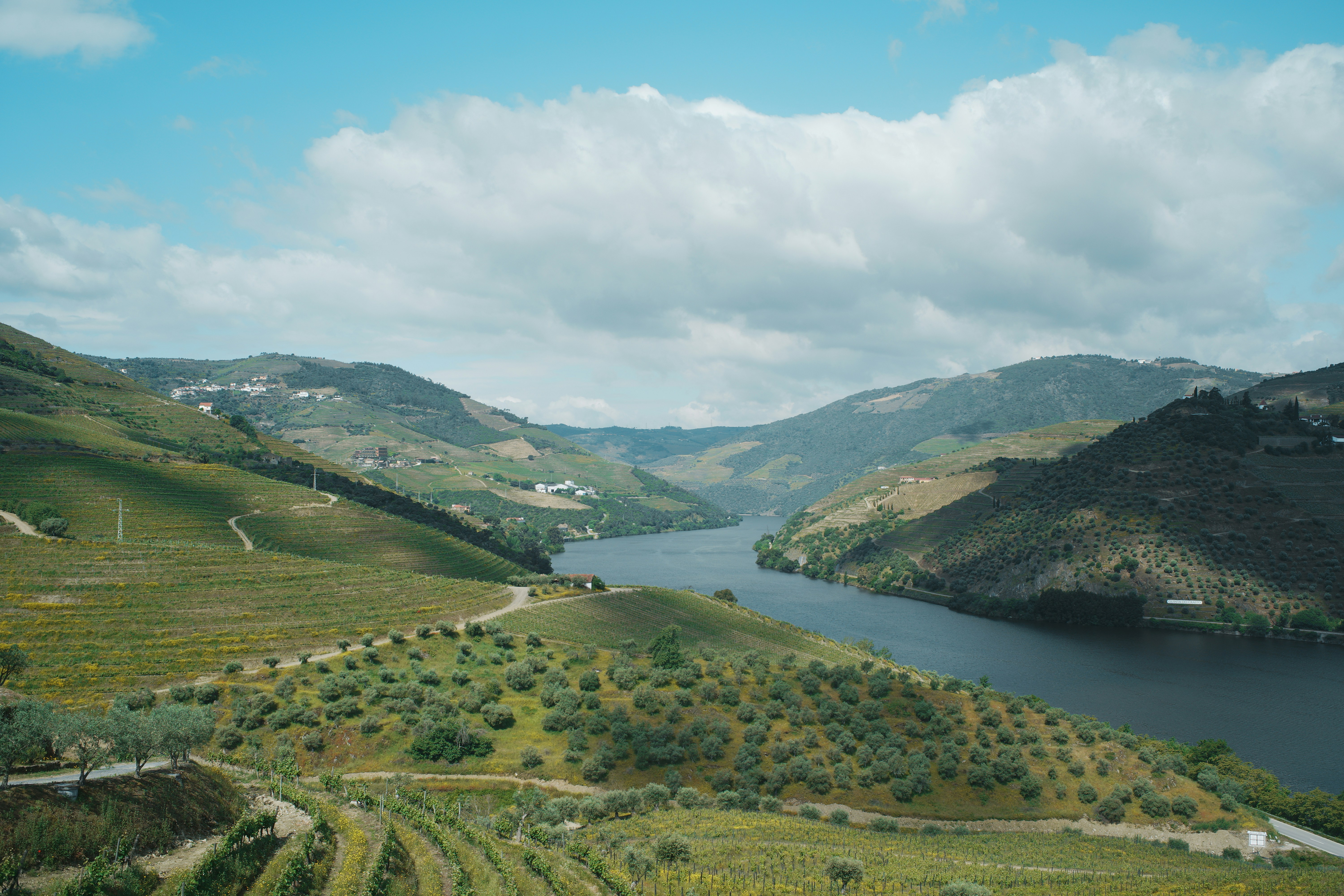 A river flows through a valley under a blue sky. photo – Free Clouds ...