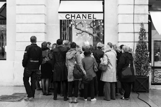 People gather to look at the chanel store.
