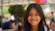 A smiling young girl poses for the camera.